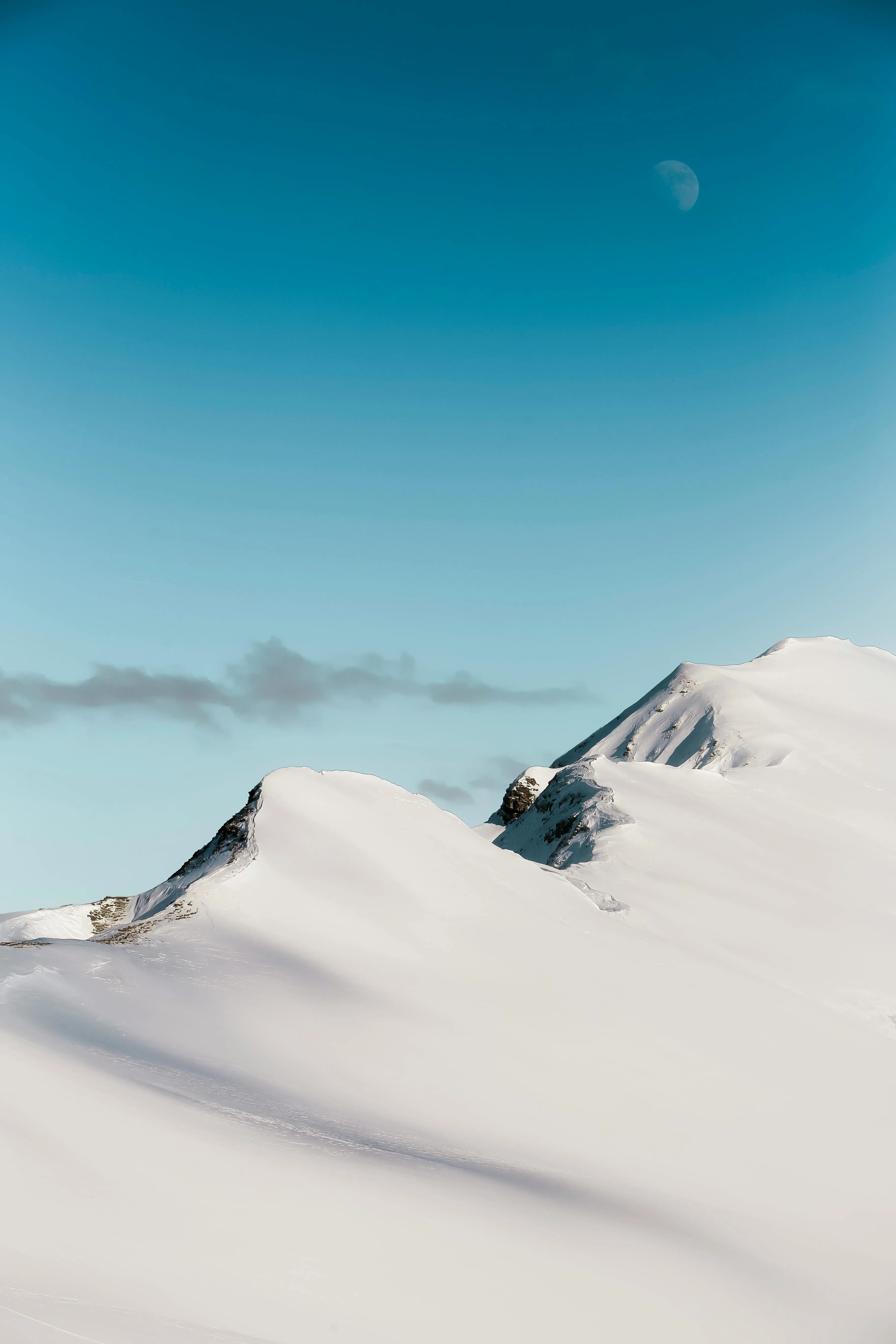 Snow Covered Mountain Peak Under Clear Blue Sky Wallpaper