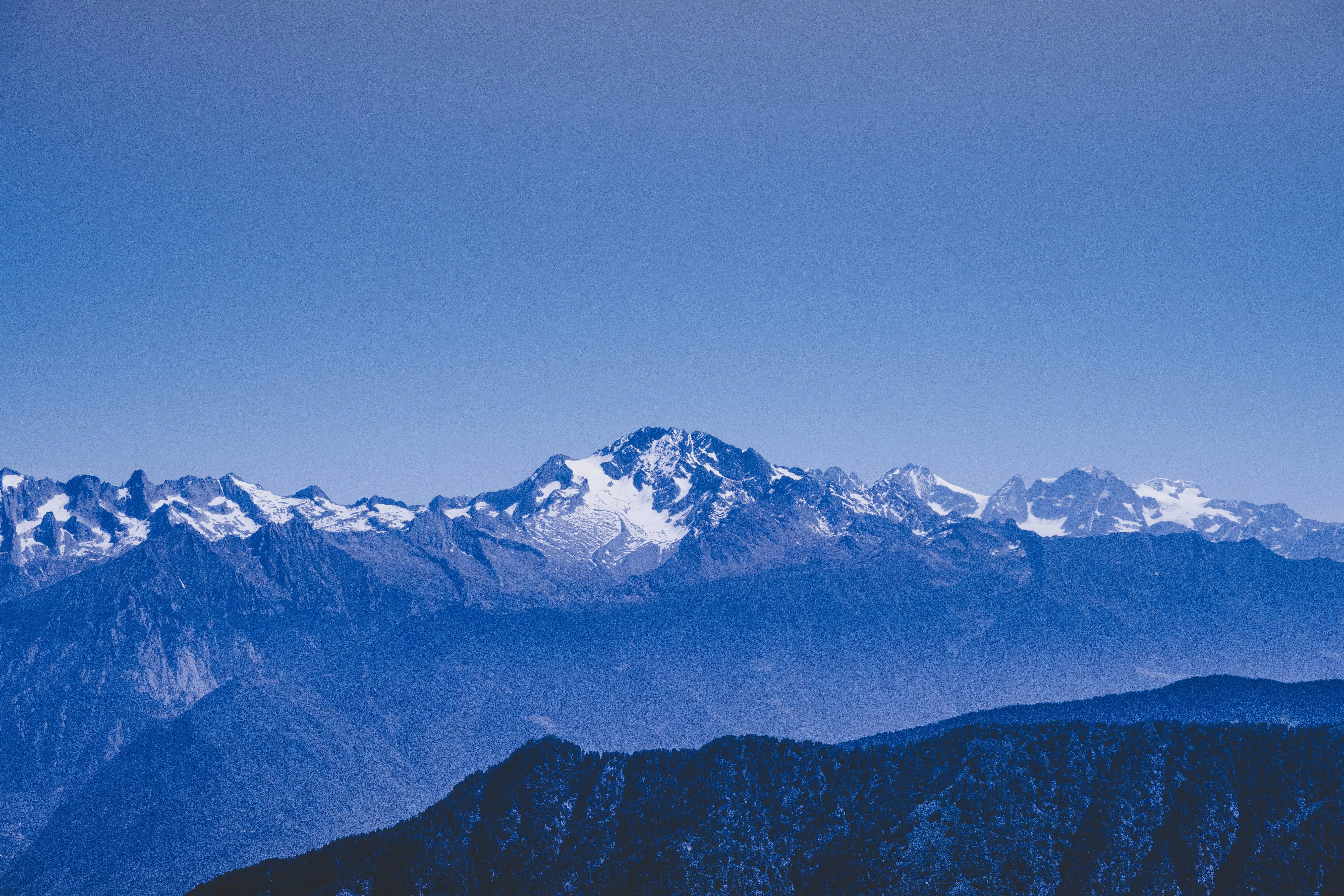 Snow Covered Mountains Under Bright Blue Sky Wallpaper