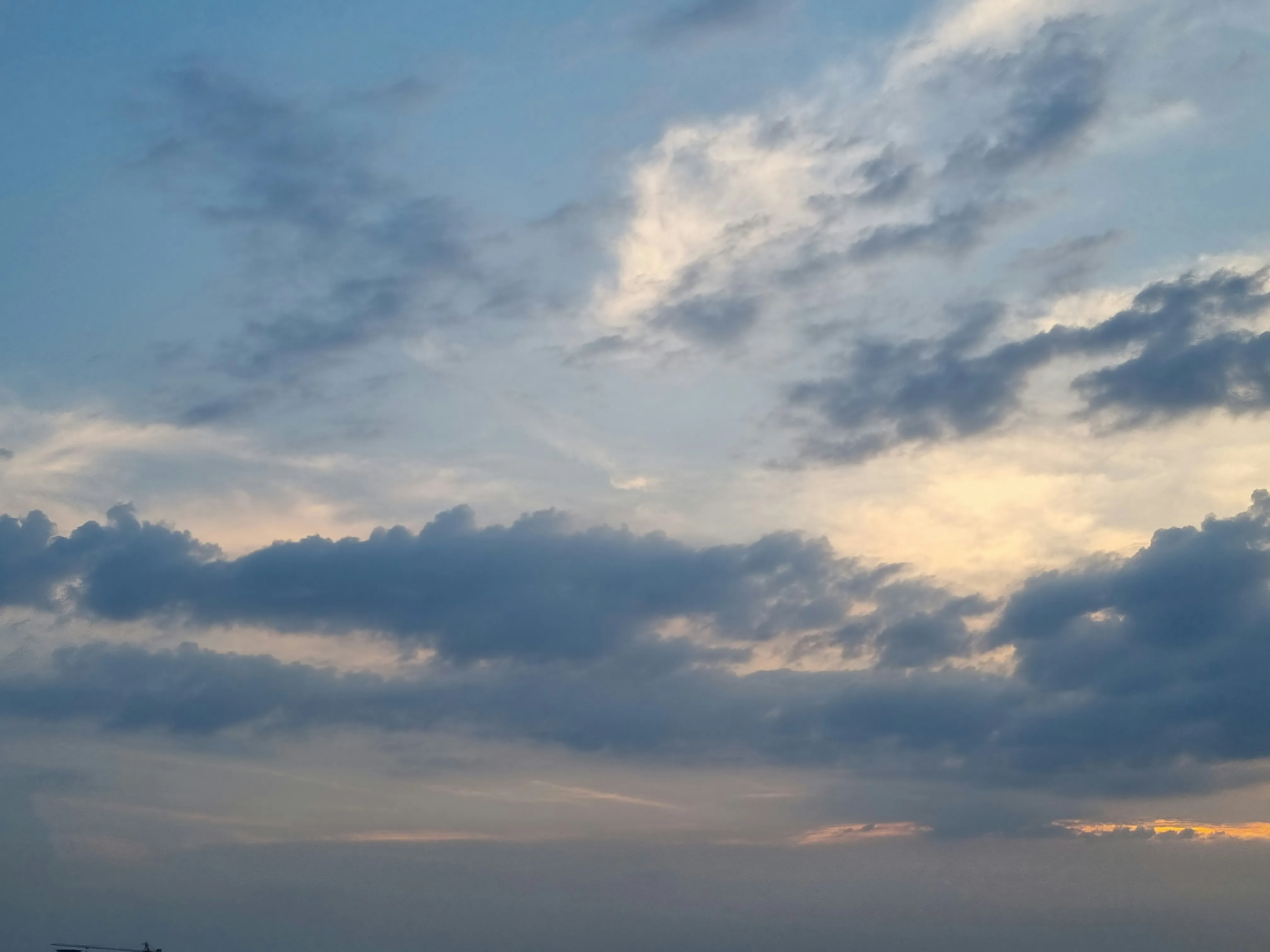 Soft Cloud Layers in Subtle Blue Sky Over Horizon Wallpaper