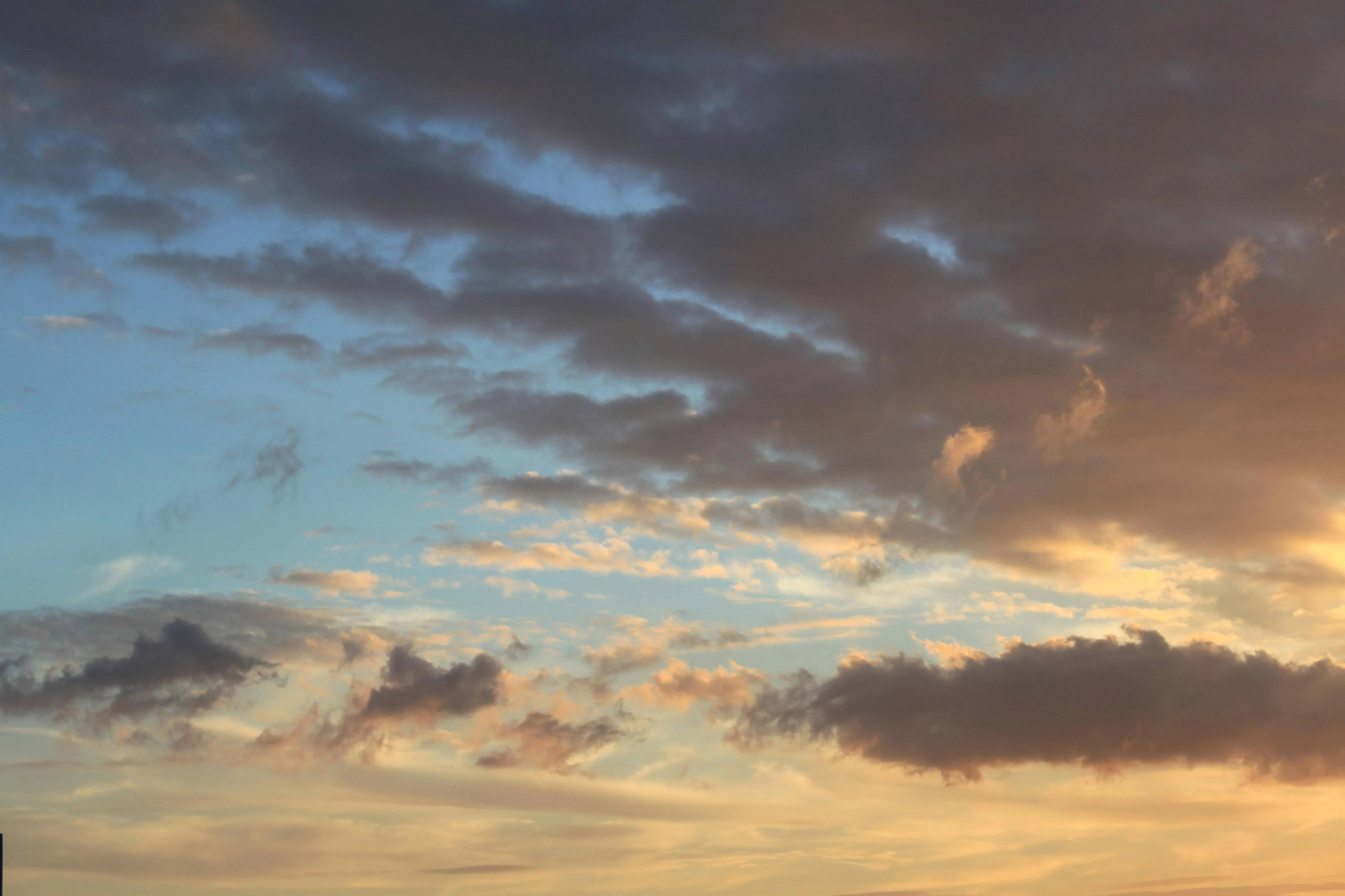 Soft Clouds at Dusk with Fading Light on Horizon Image