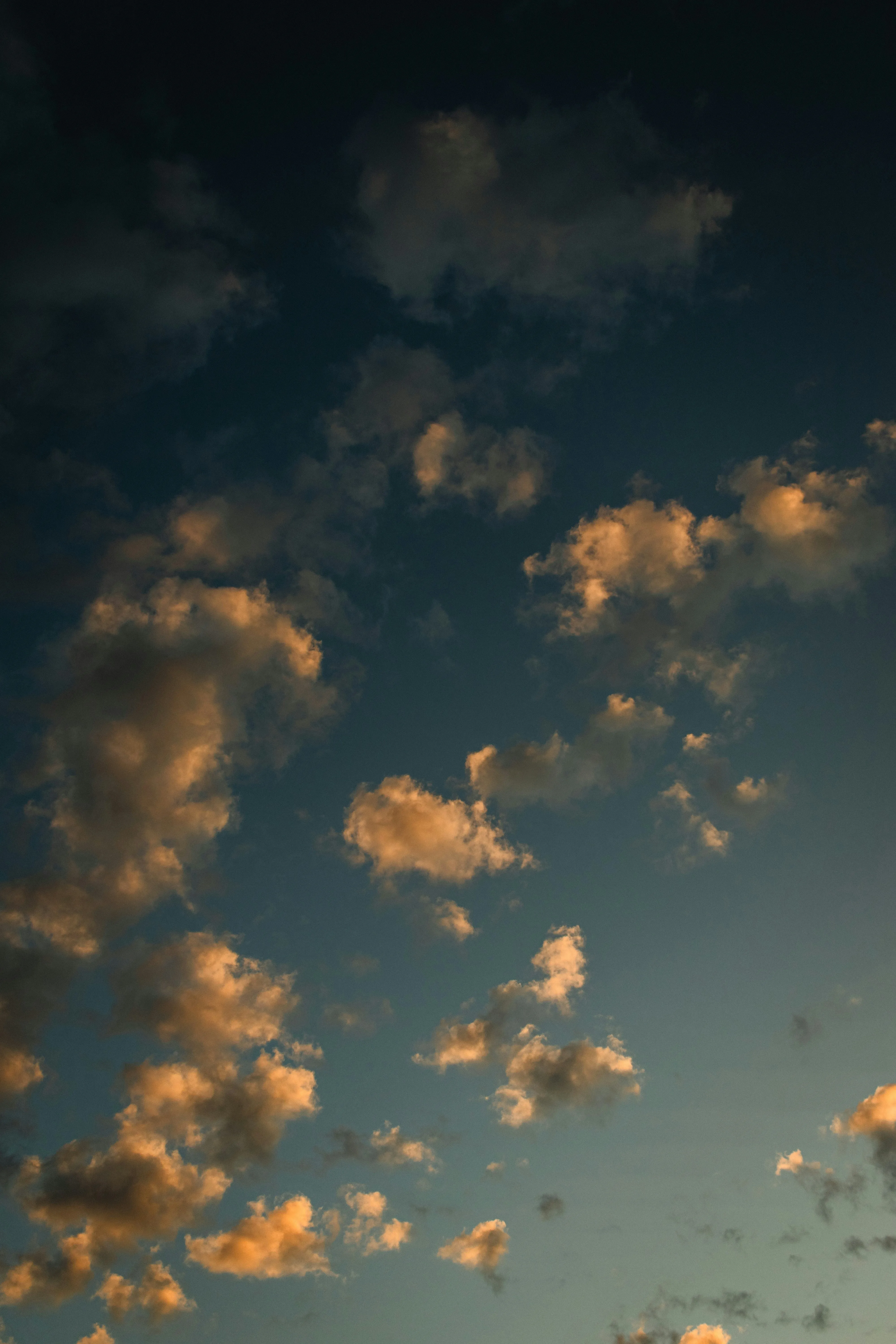 Soft Golden Clouds Floating During Sunset Time Wallpaper
