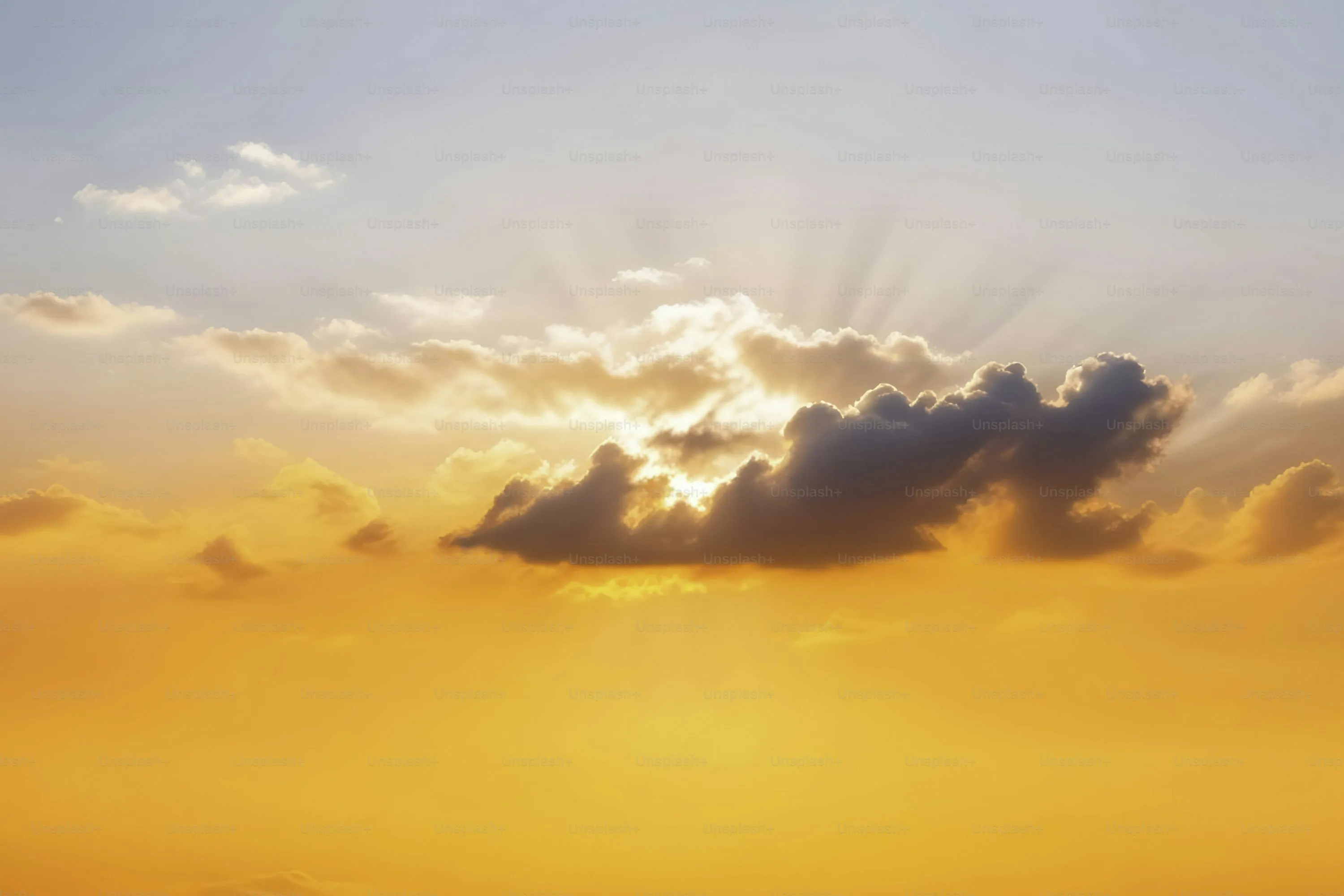 Soft Orange Sky with Wispy Clouds at Sunset Wallpaper