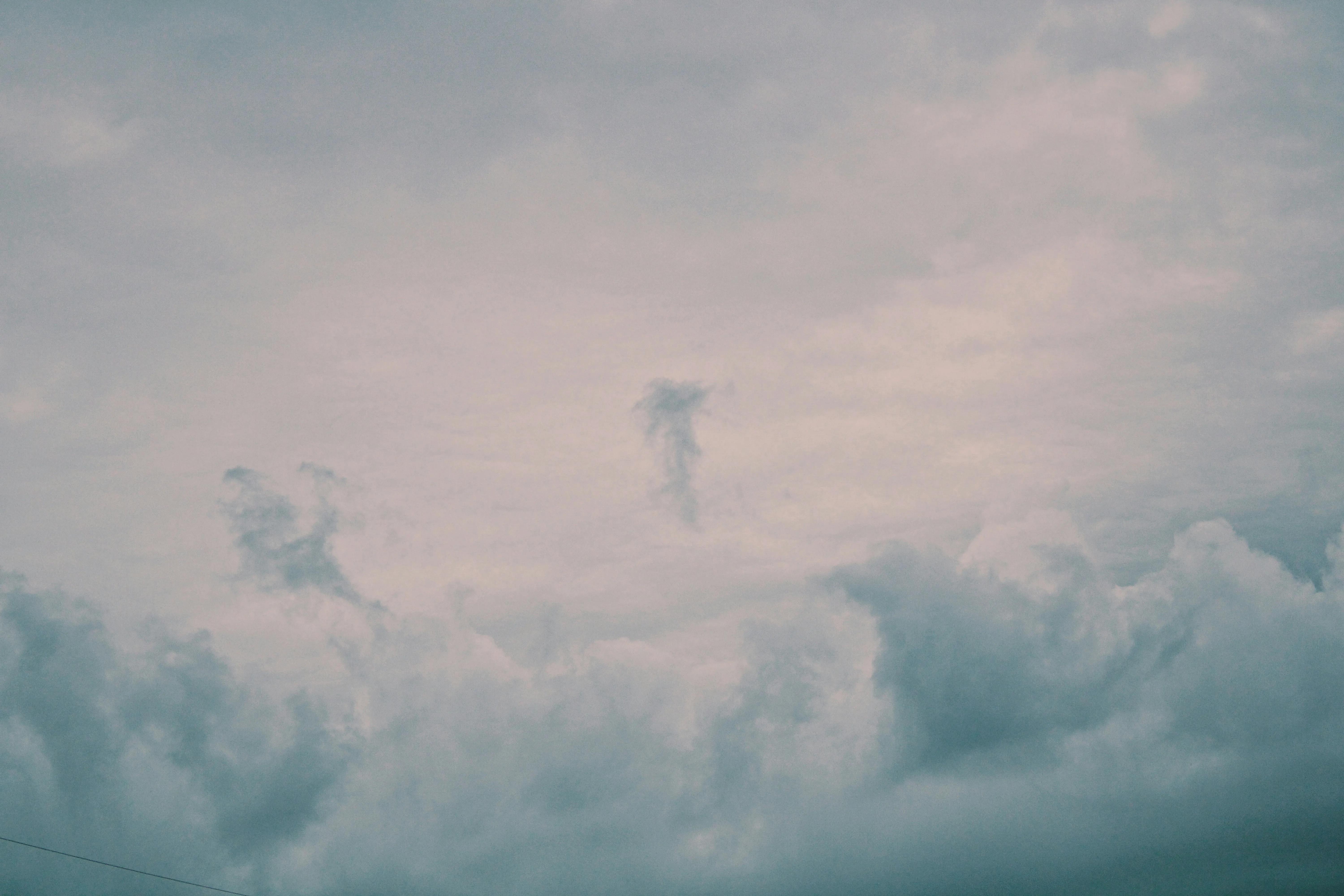 Soft Pastel Colored Clouds Filling the Sky on a Calm Day