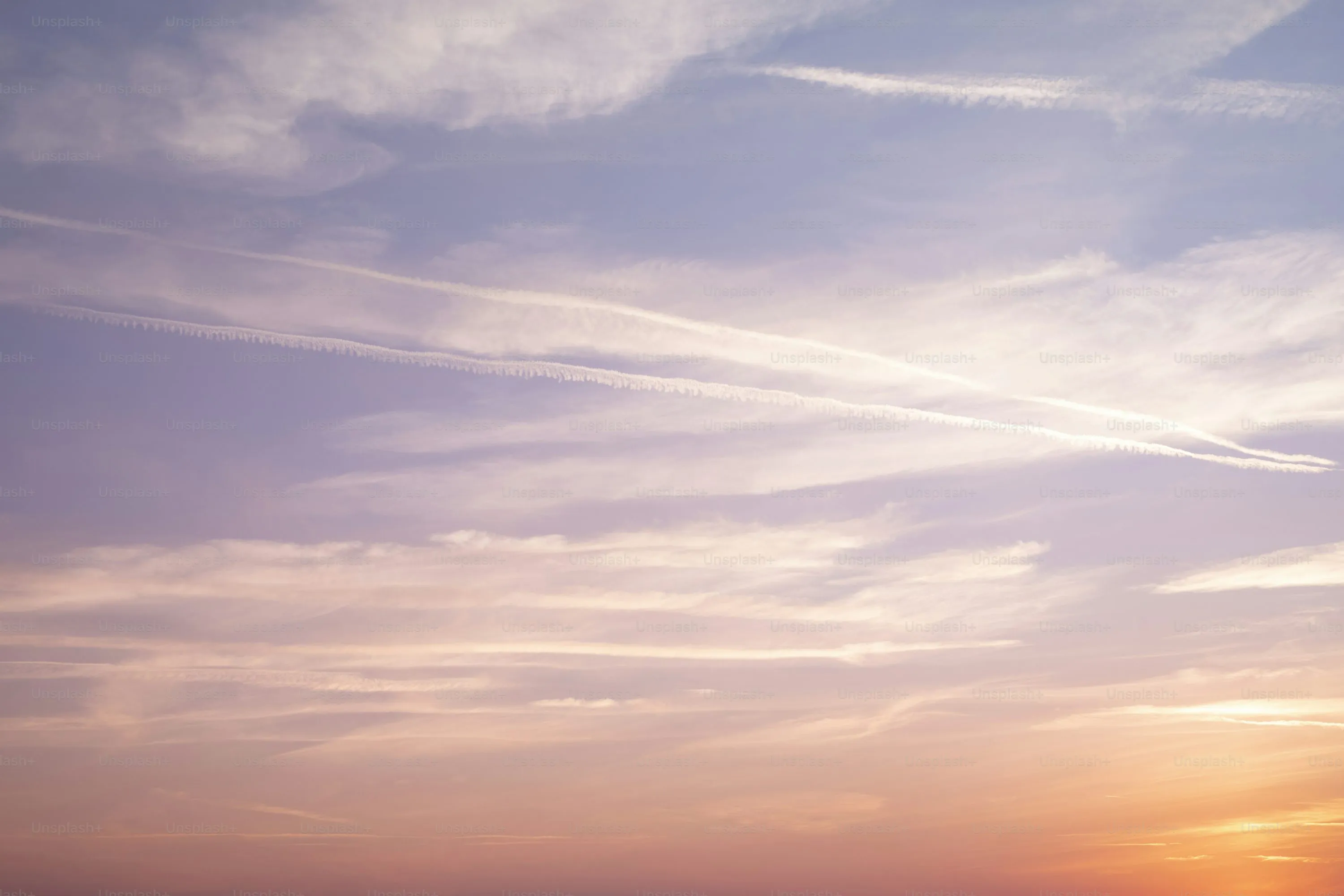 Soft Pastel Sky with Thin Clouds During Sunrise Wallpaper