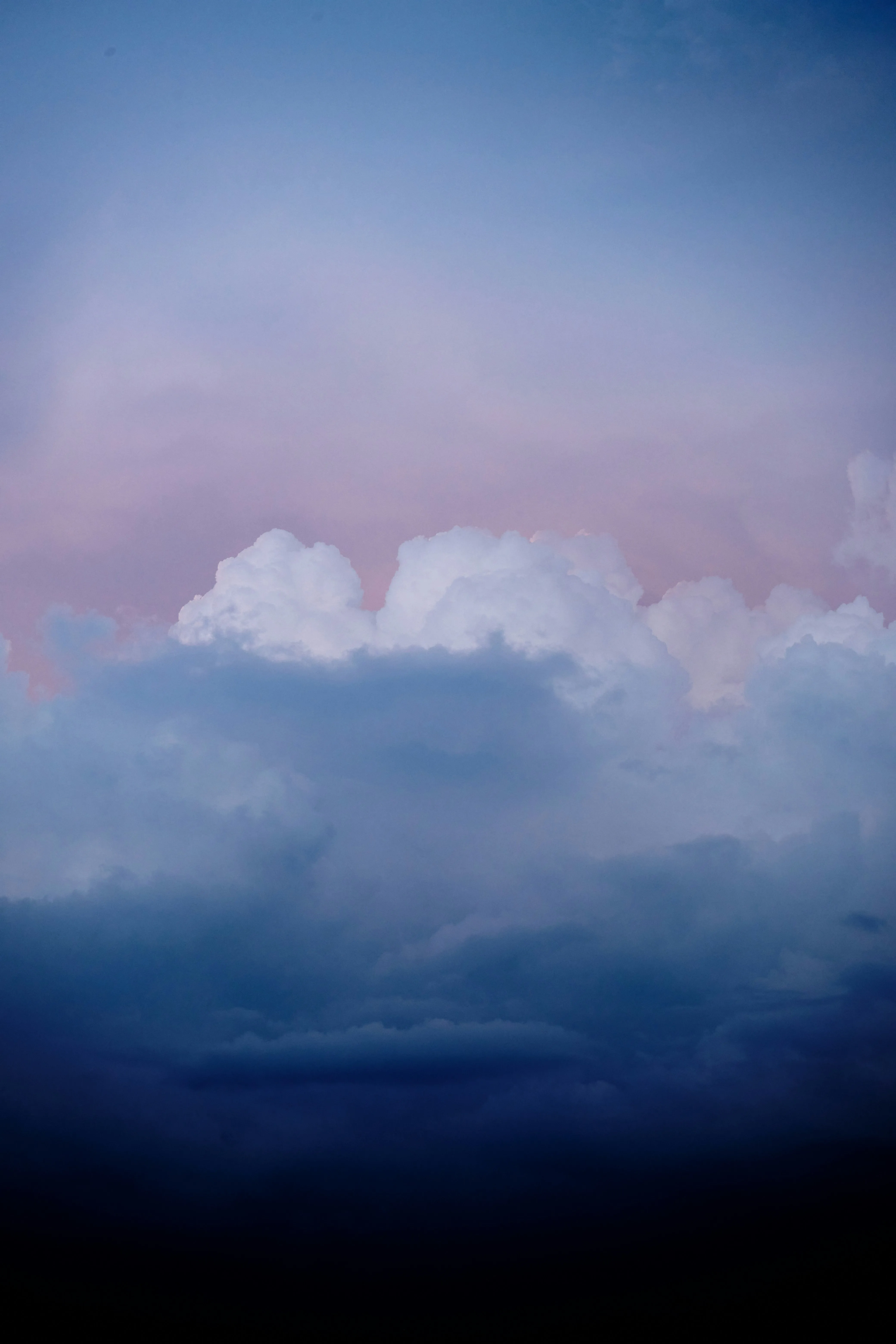 Soft Pink and Blue Clouds Forming a Peaceful Evening Sky
