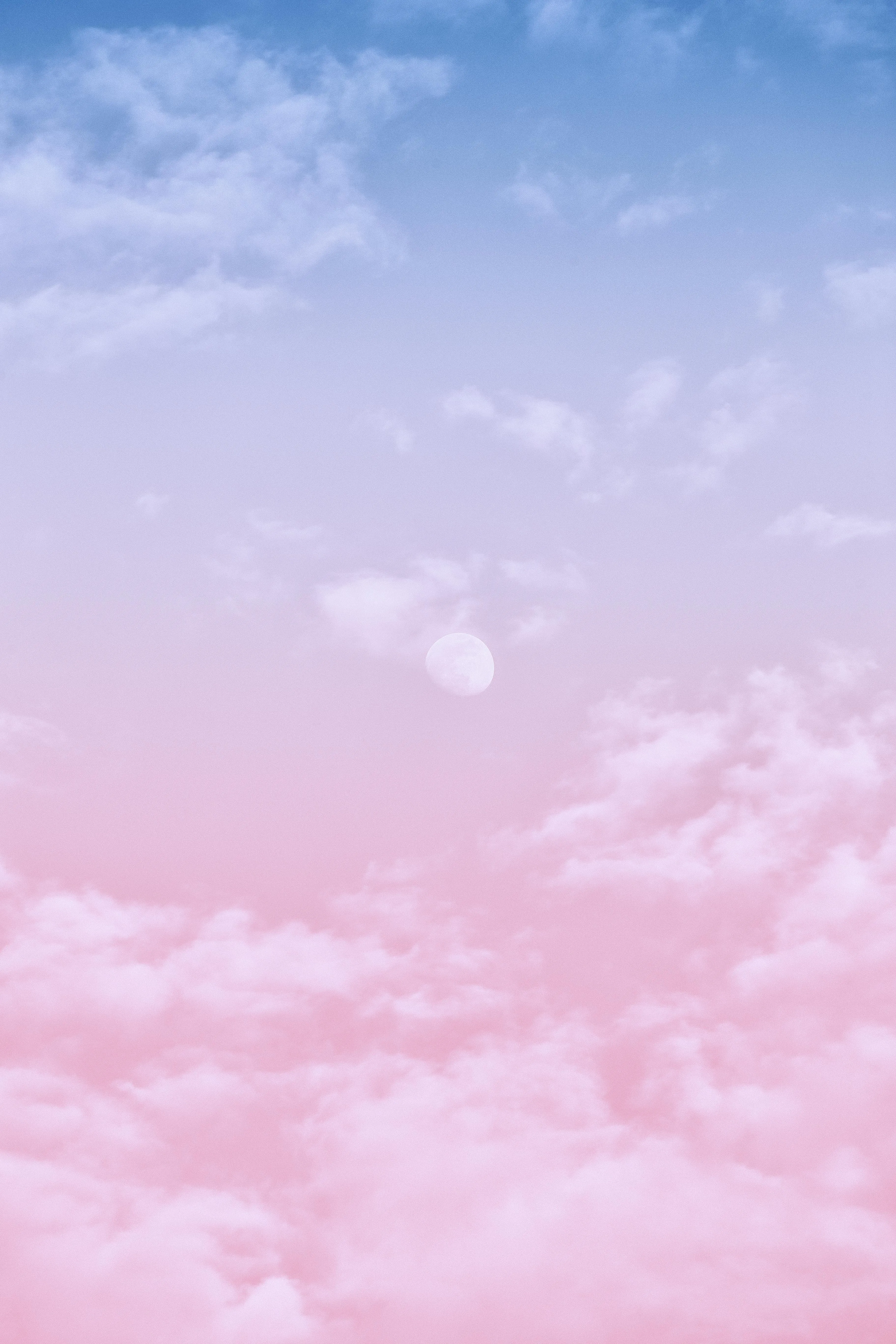 Soft Pink Clouds in a Serene Pastel Colored Sky Wallpaper