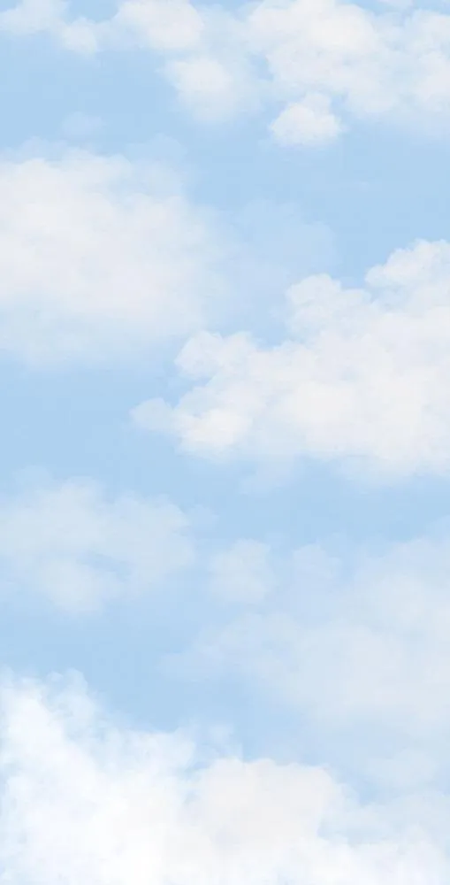 Soft White Puffy Clouds Floating in Bright Blue Sky
