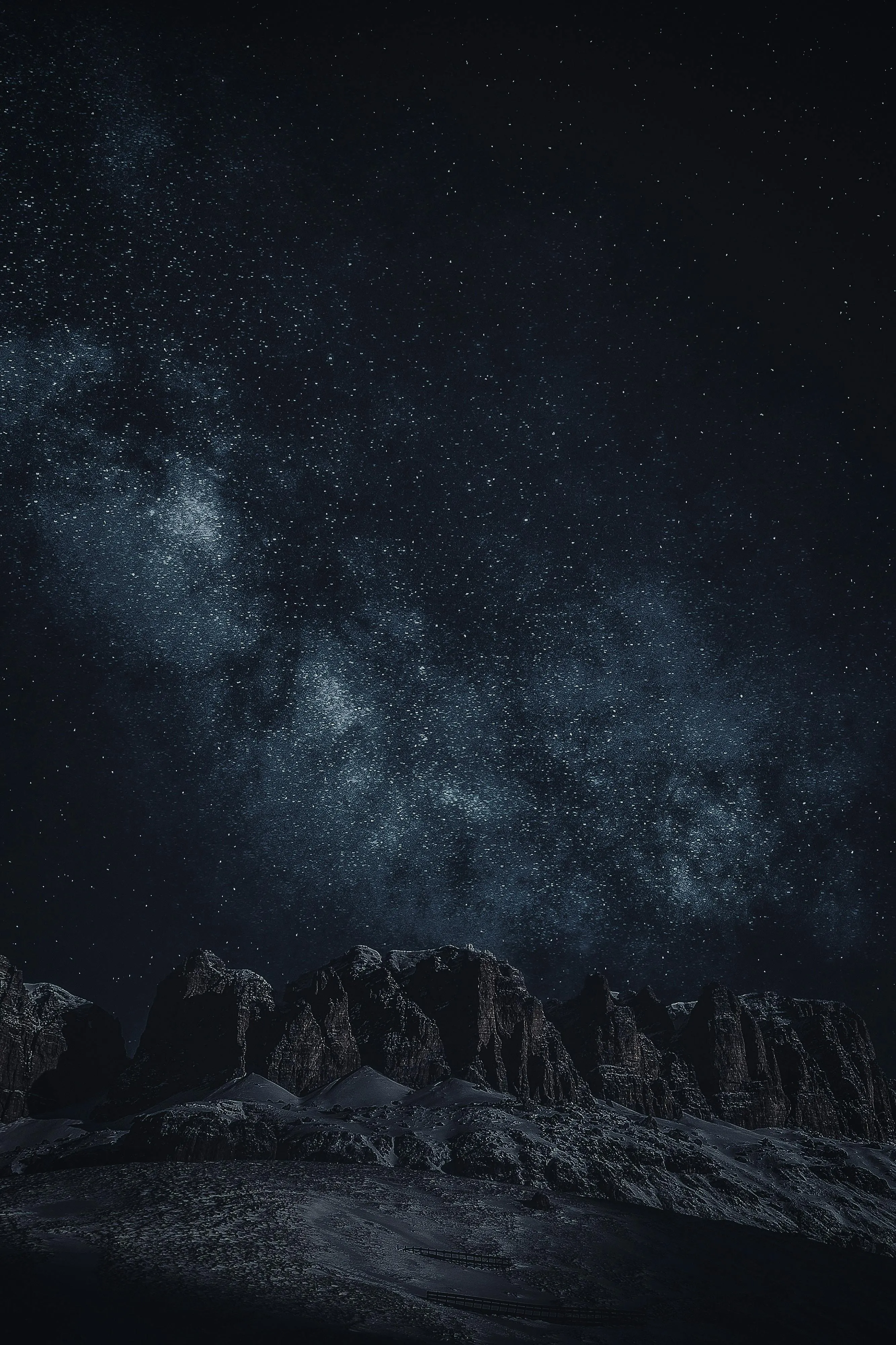 Starry Night Sky Over Rocky Mountain Landscape at Dusk