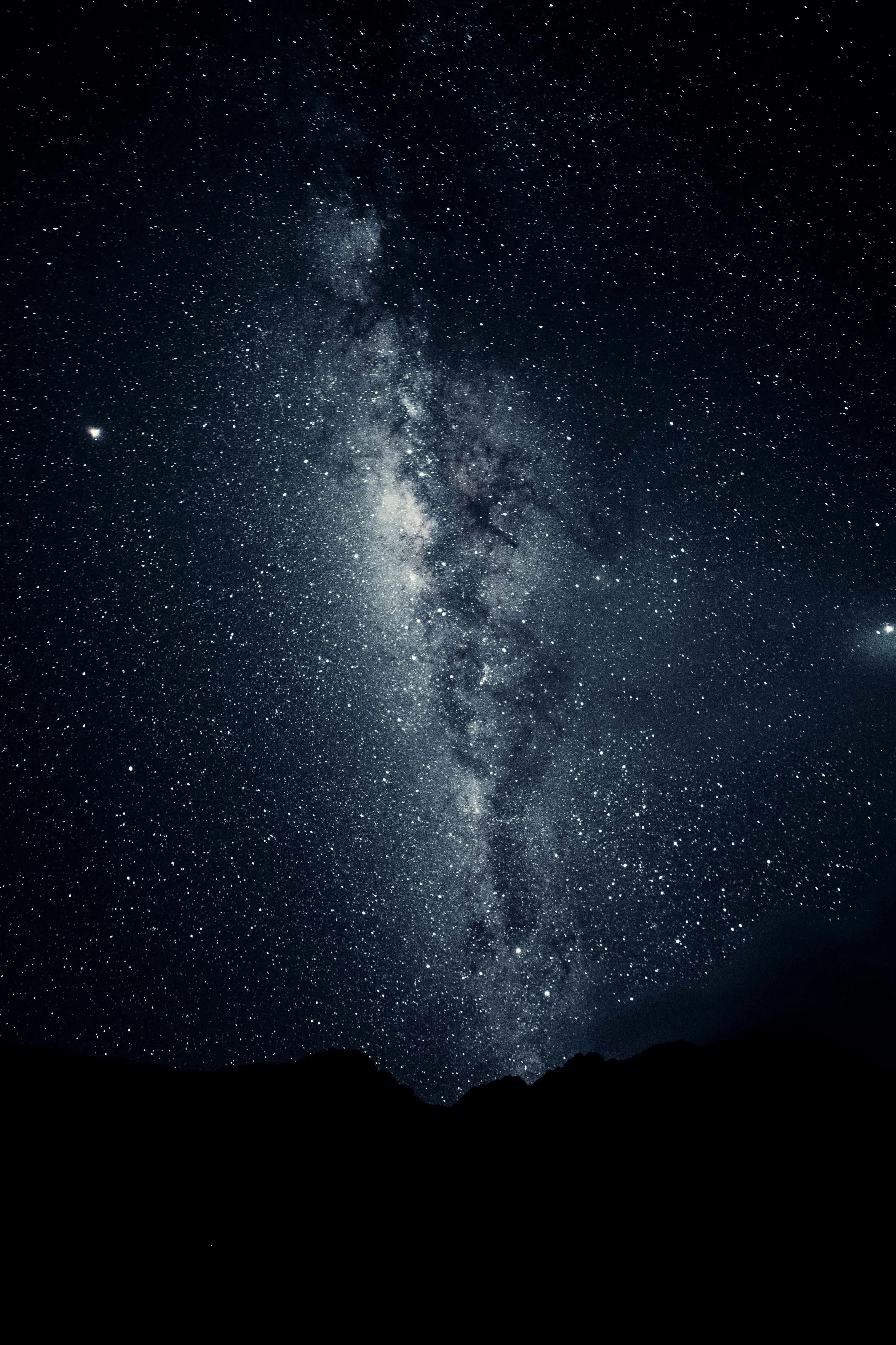 Starry Night with Faint Clouds and Deep Black Sky Wallpaper