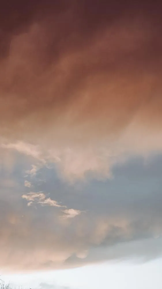 Storm Clouds Rolling Over Desert Hills During Sunset
