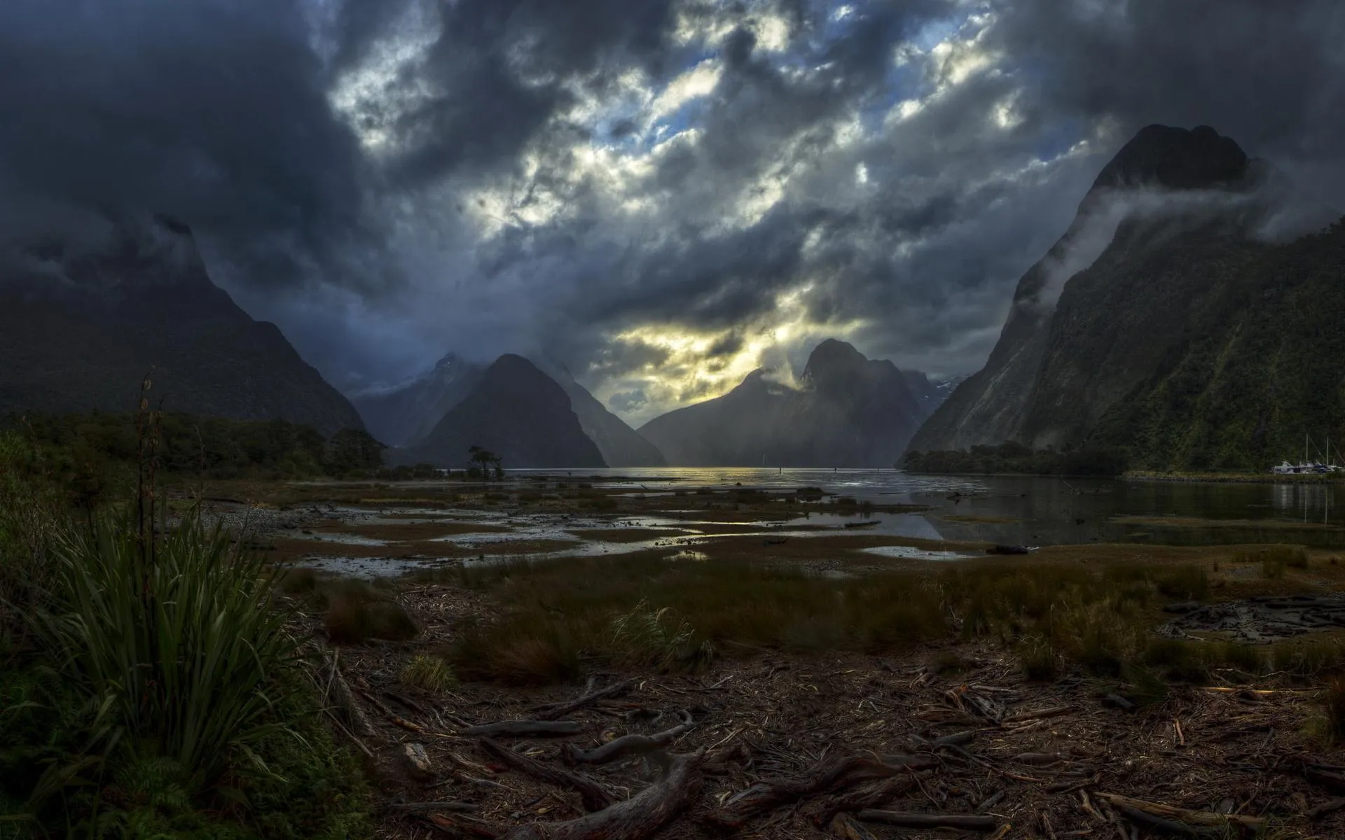 Stormy sky over rugged mountainous landscape Wallpaper