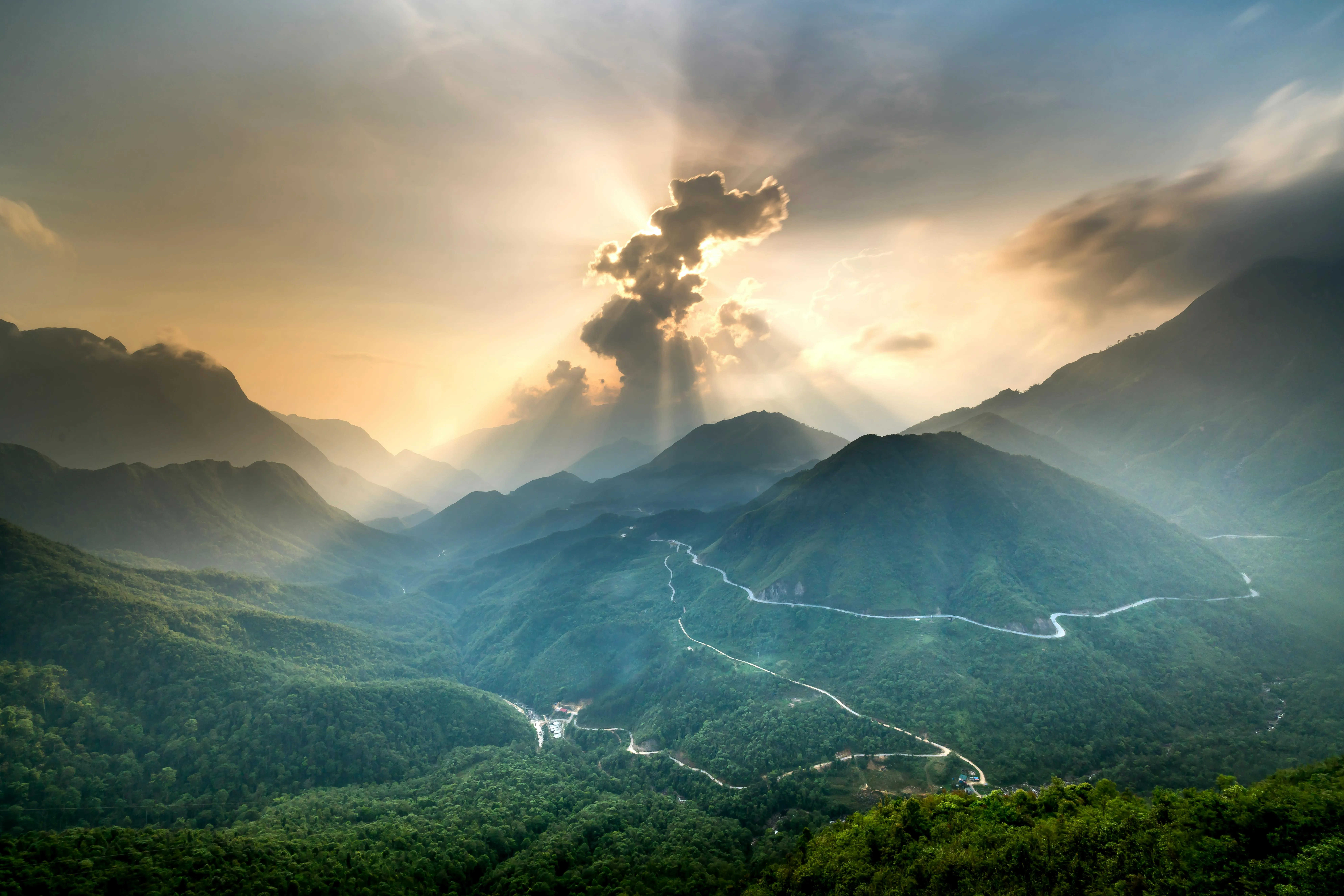 Stunning Mountain Valley Bathed in Golden Sunlight Wallpaper