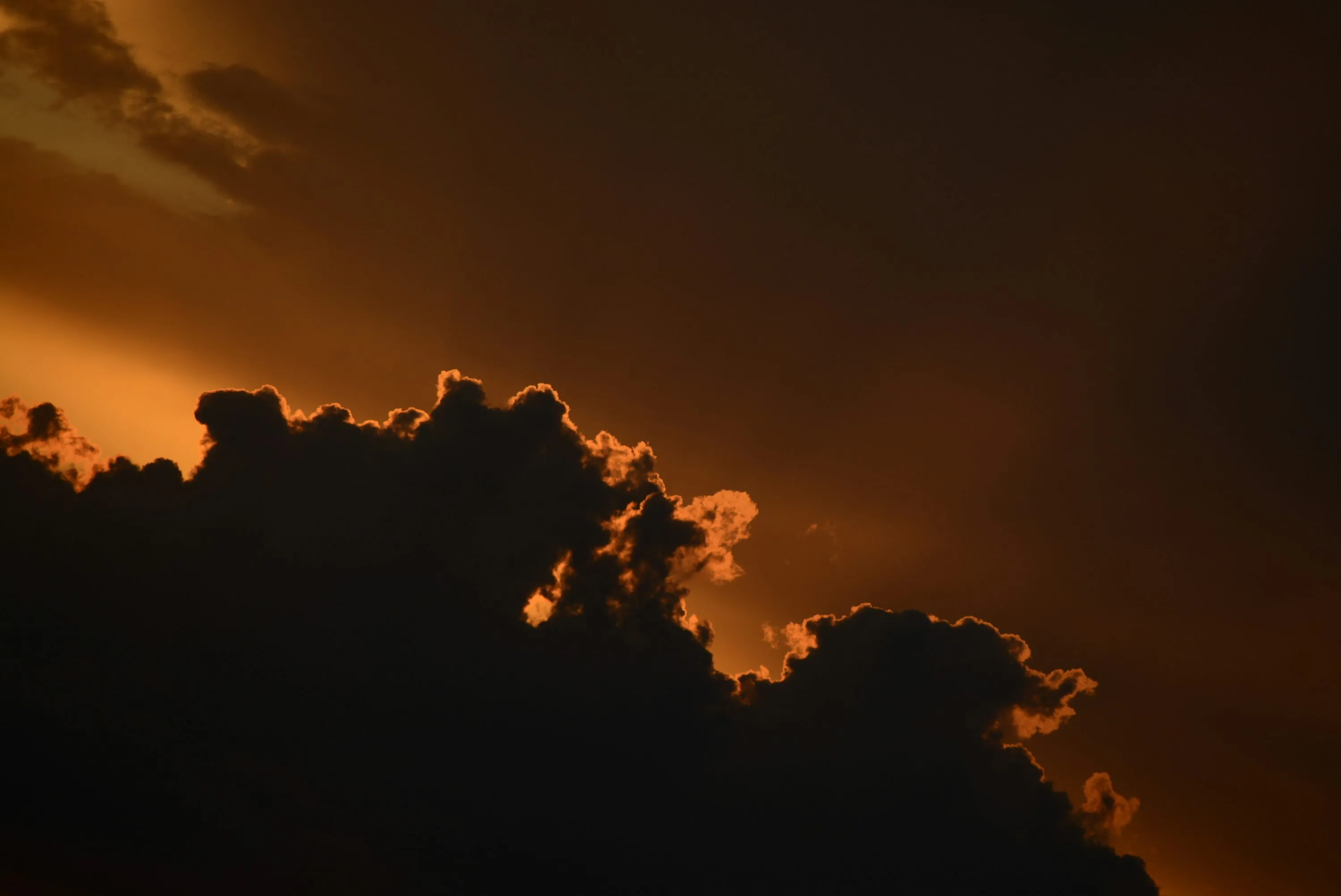 Stunning Orange Sunset Behind Silhouetted Cloud Formation