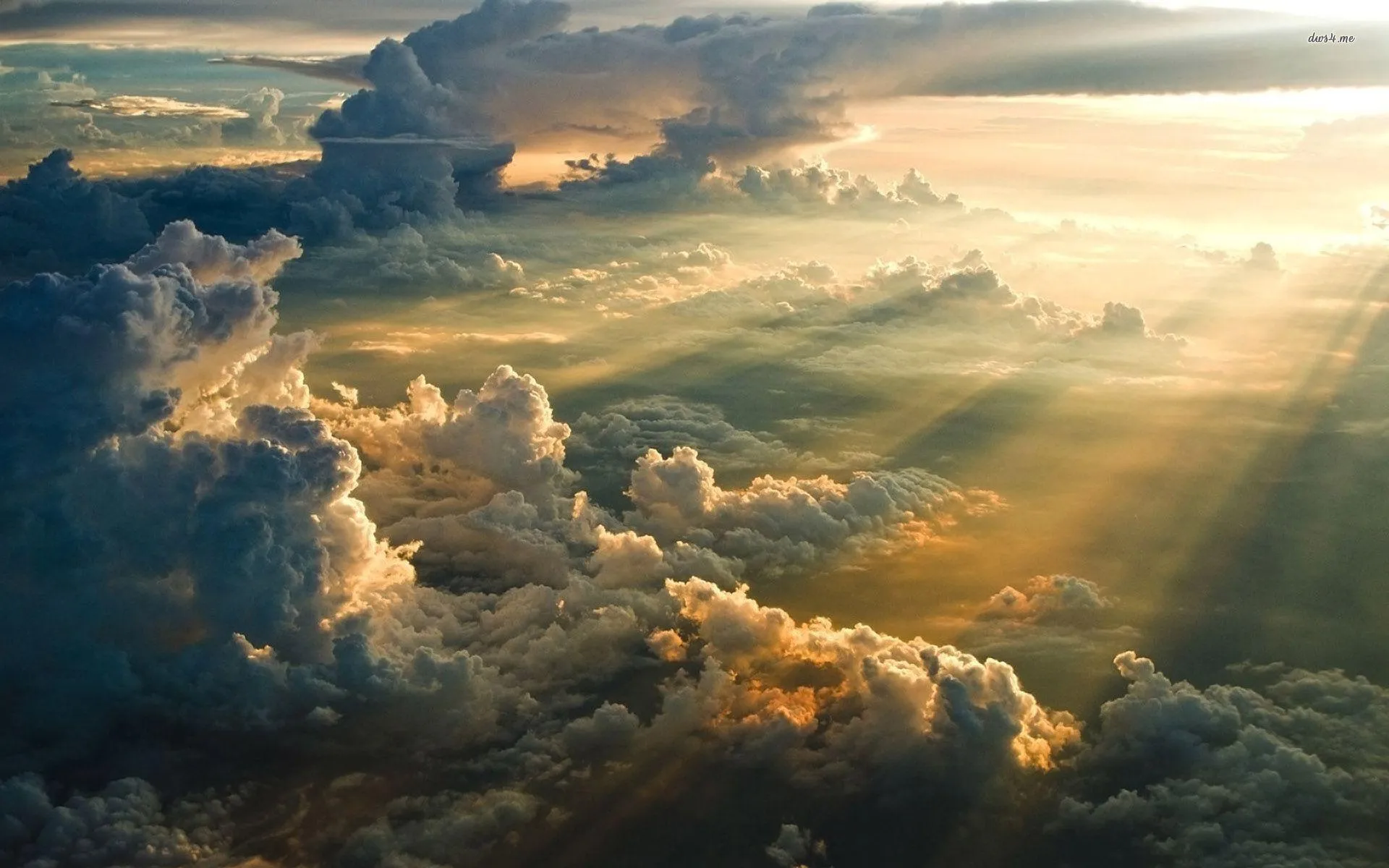 Sun Rays Breaking Through Thick Clouds Over Scenic Landscape