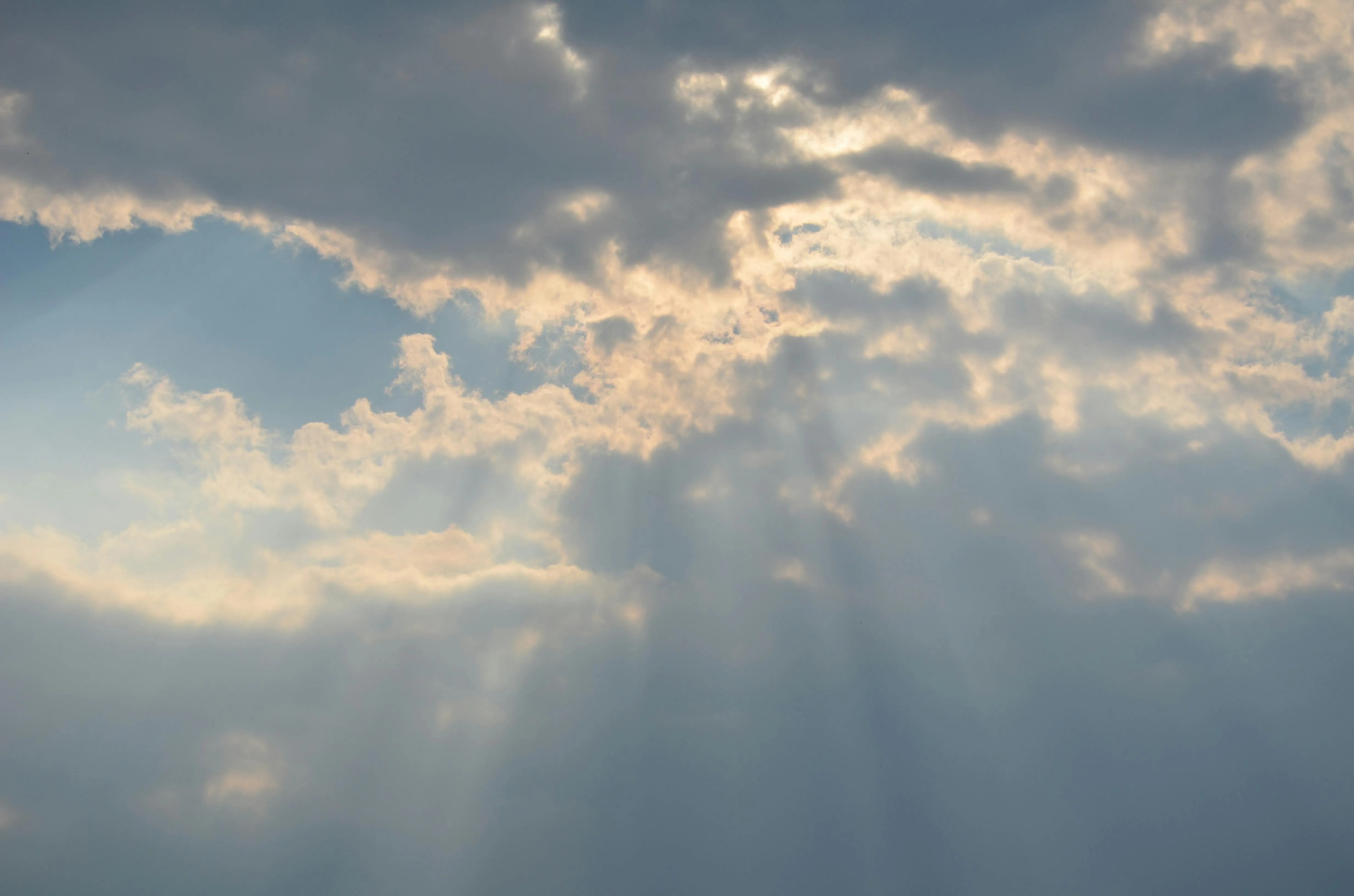Sunbeams Breaking Through Dramatic Sky Cloud Cover Image