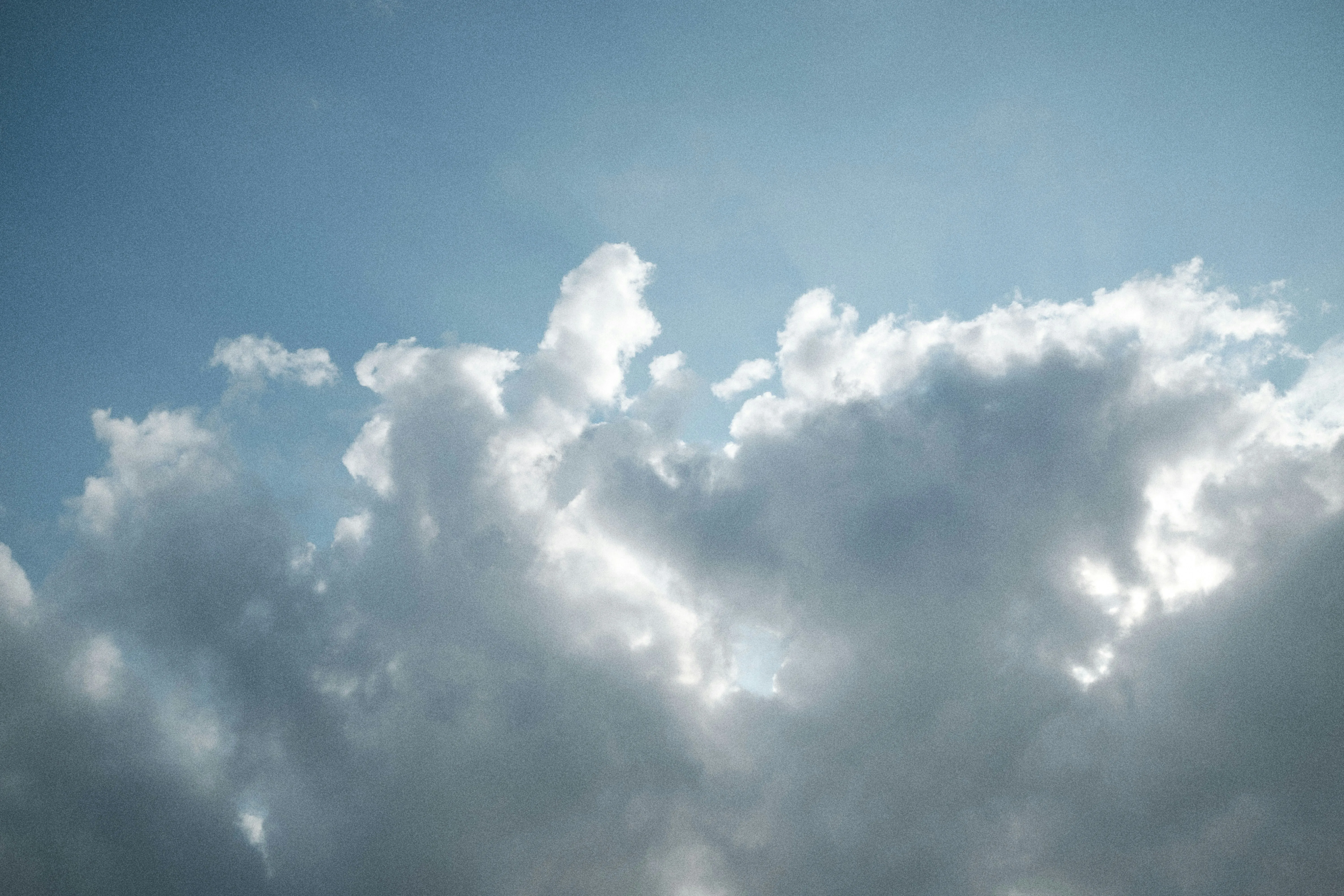 Sunlight Breaking Through Silver Lined Clouds Free Image