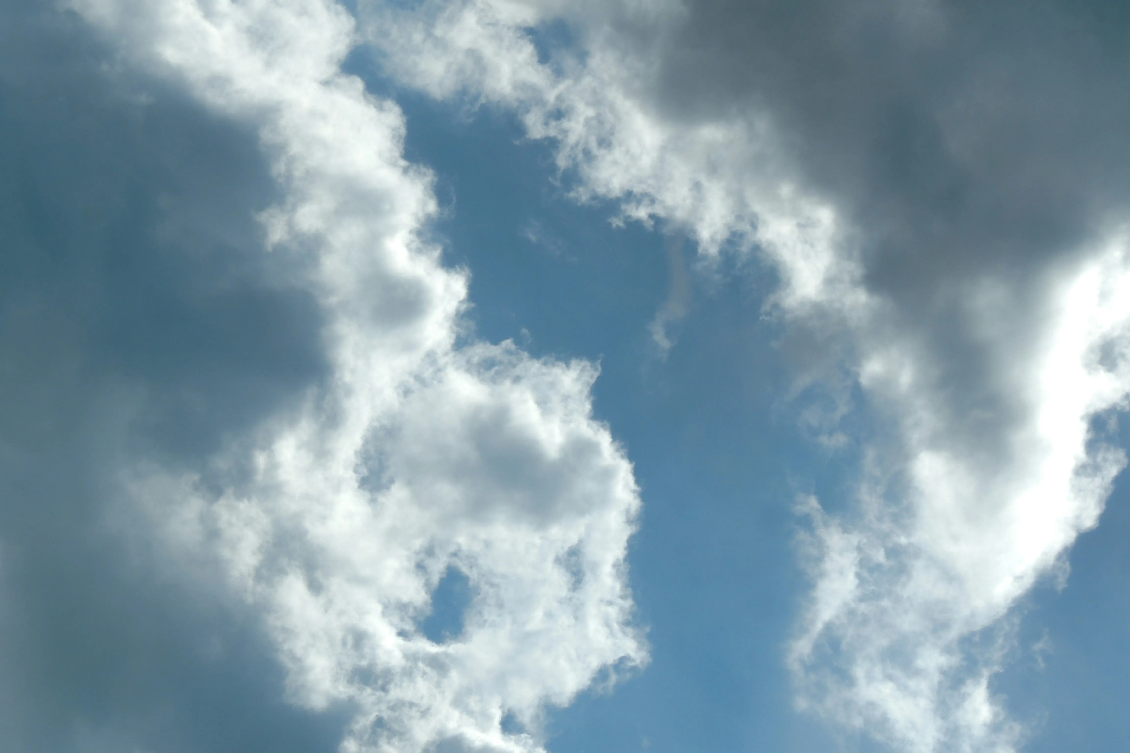 Sunlight Breaking Through Stormy Cumulus Clouds Image