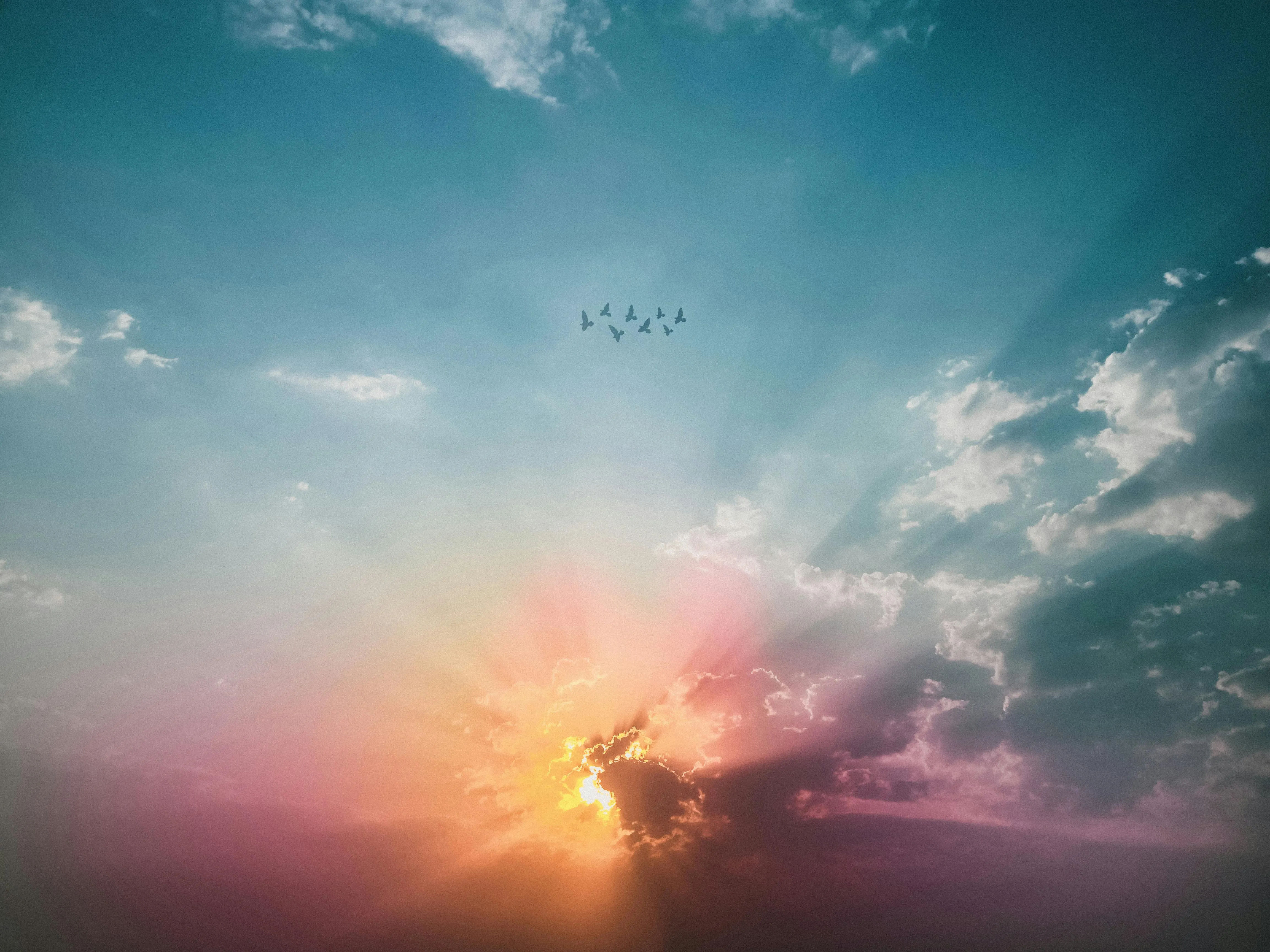 Sunrise Breaking Through Clouds with Birds Flying Image