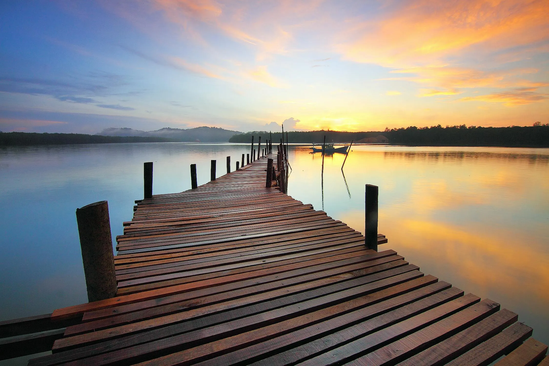 Sunset at Pier with Calm Water and Wispy Clouds Wallpaper