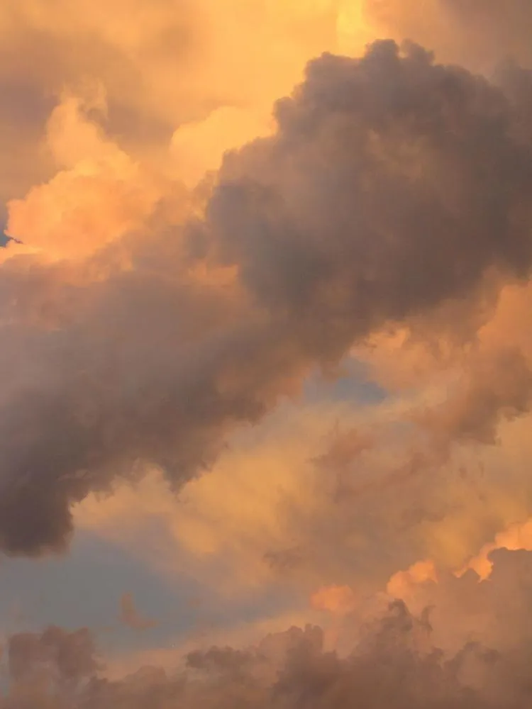 Sunset Clouds Painted in Warm Shades of Gold and Red