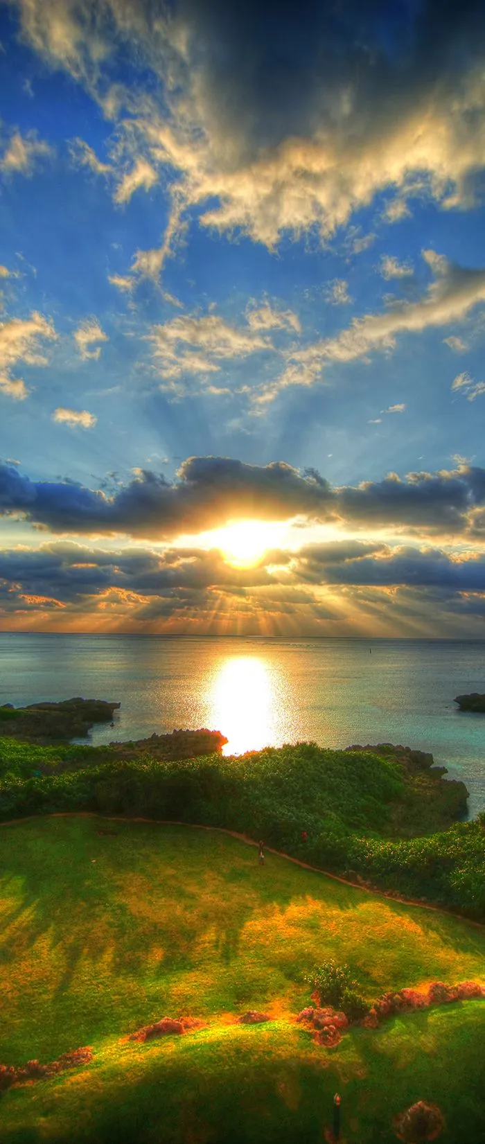 Sunset Glow Over Rolling Green Hills By the Ocean Shore