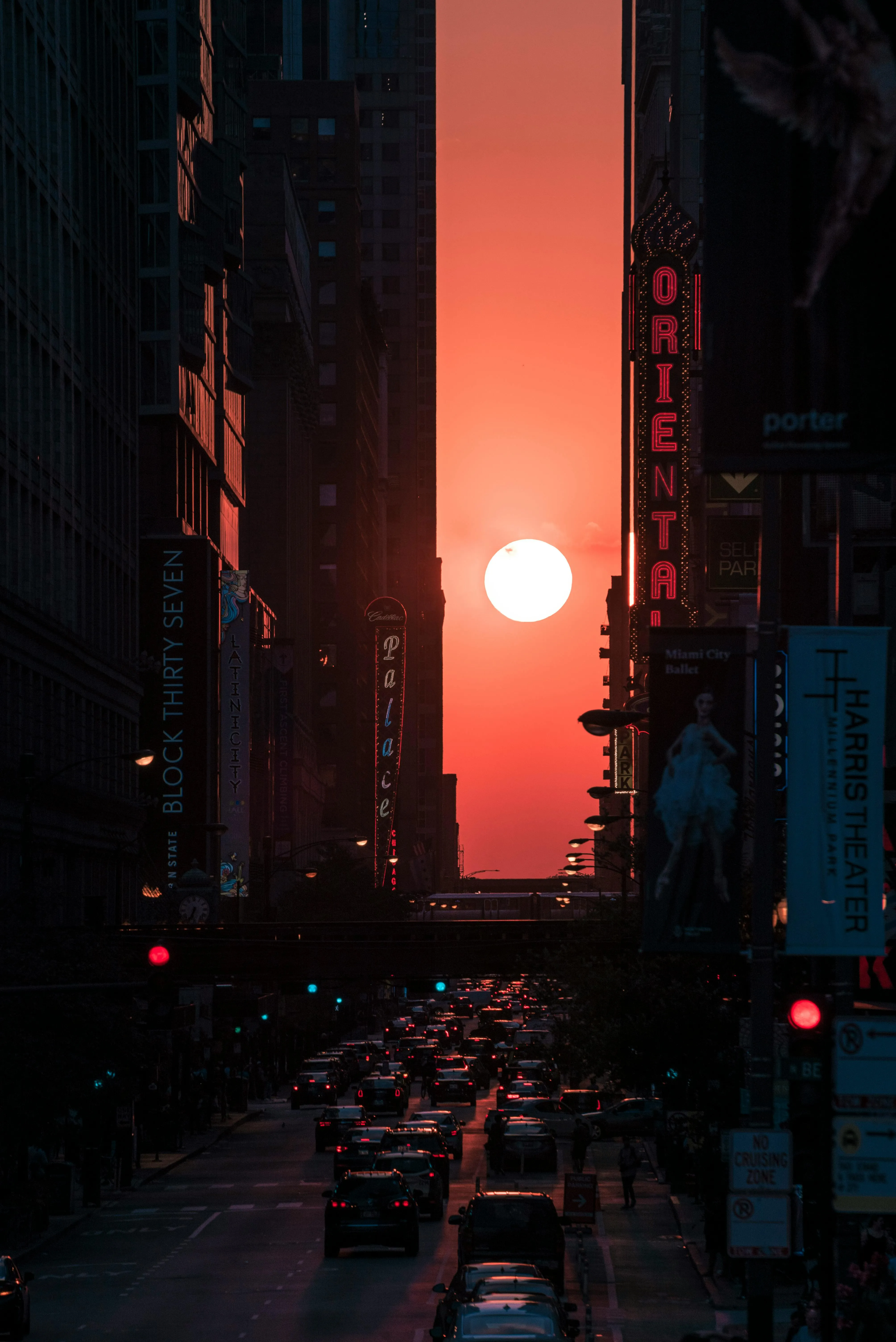 Sunset Glowing Through City Street with Tall Buildings