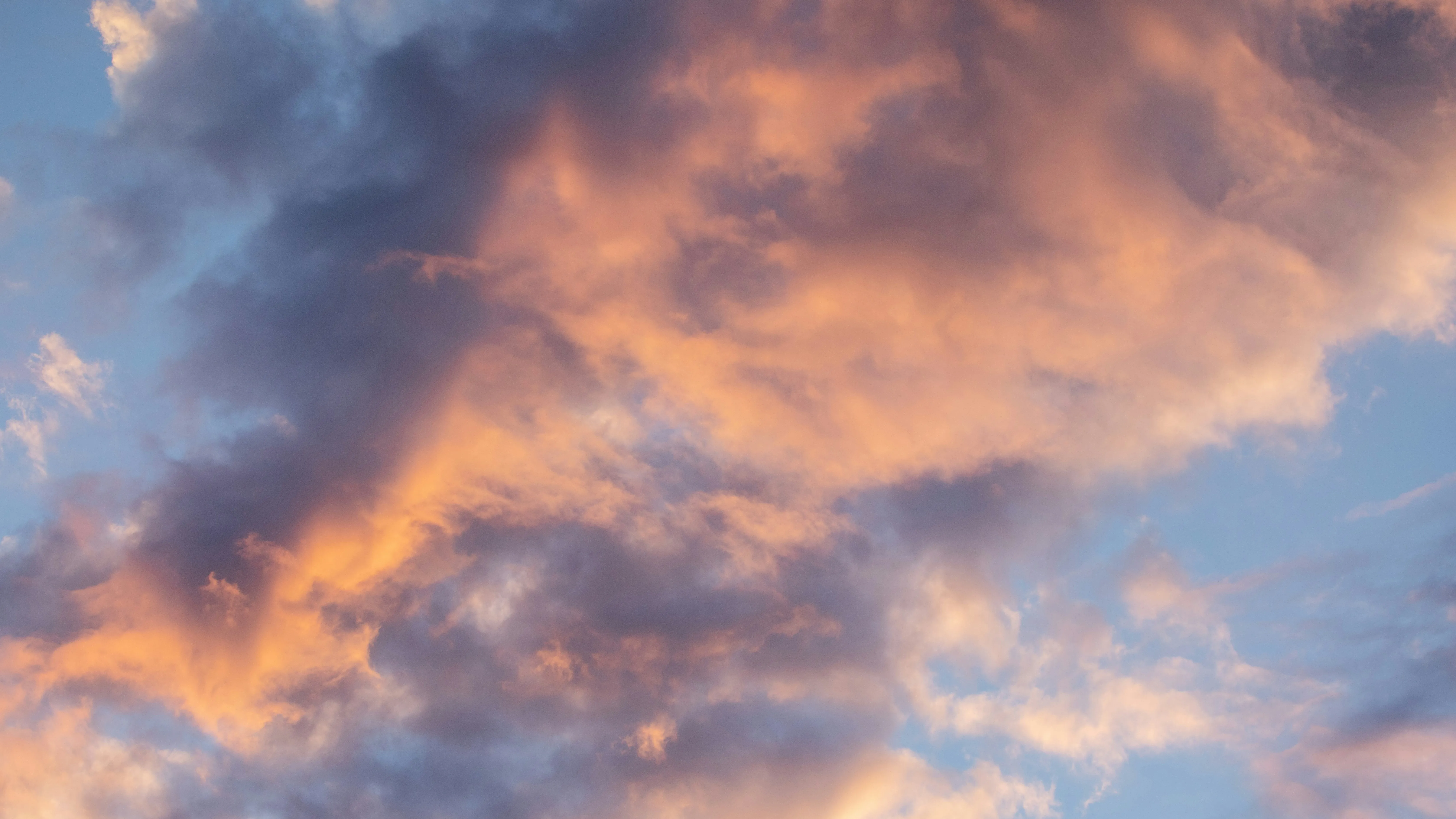 Sunset Sky with Orange and Pink Clouds Creating Warm Glow