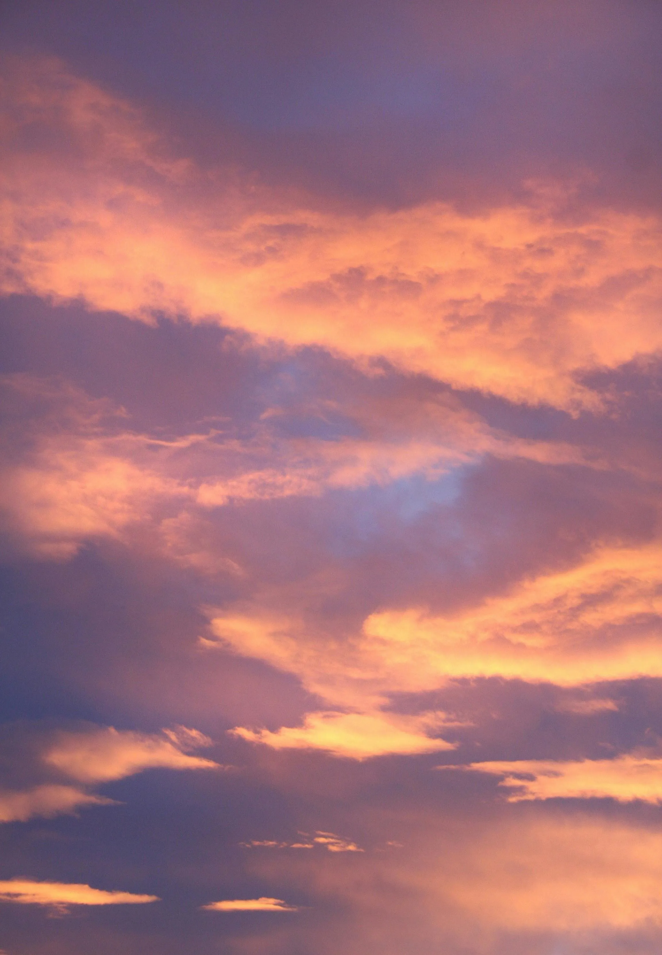 Sunset Sky with Soft Orange and Purple Cloud Streaks