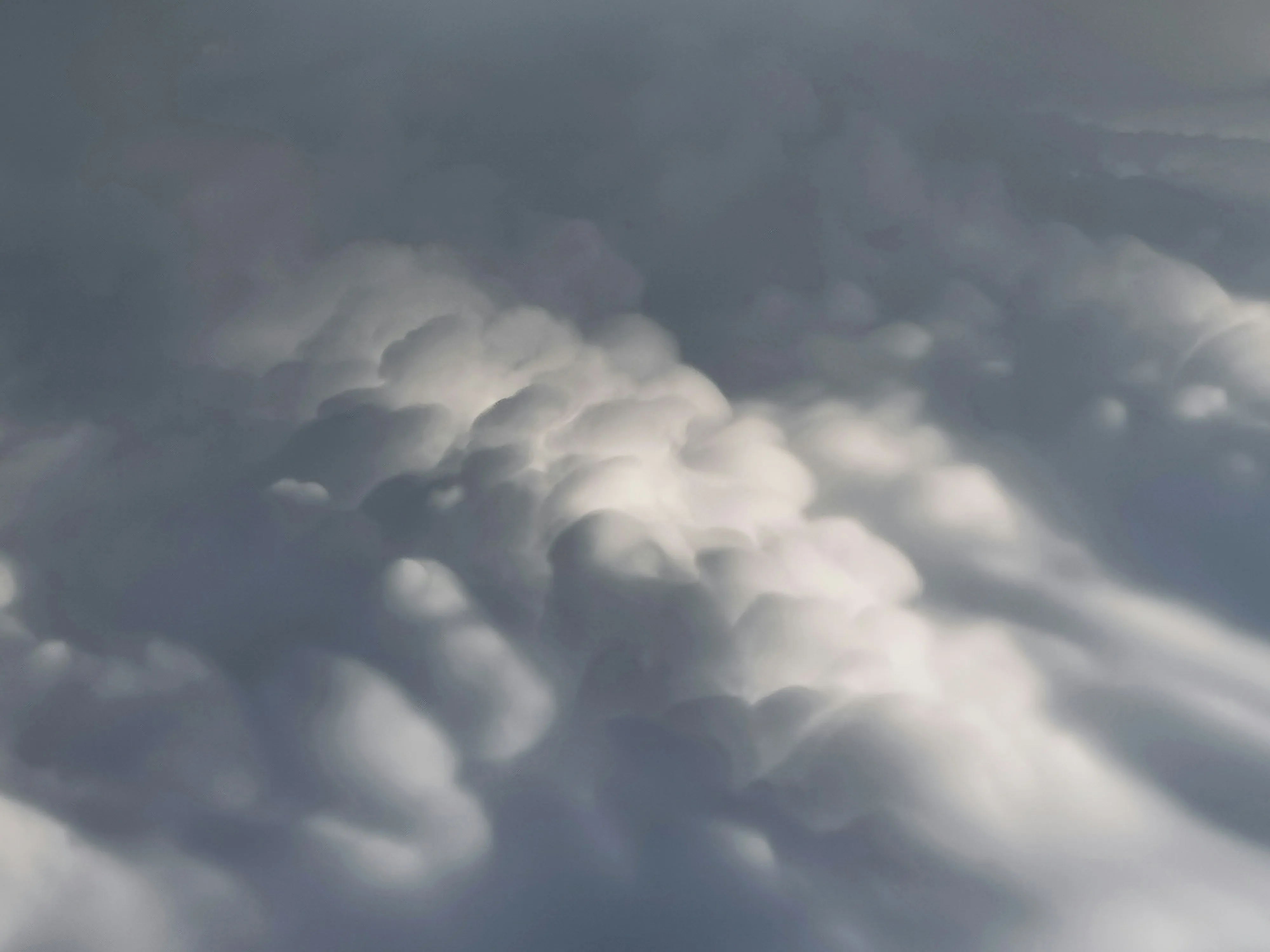 Thick Cloud Layers Seen From Airplane Window Wallpaper