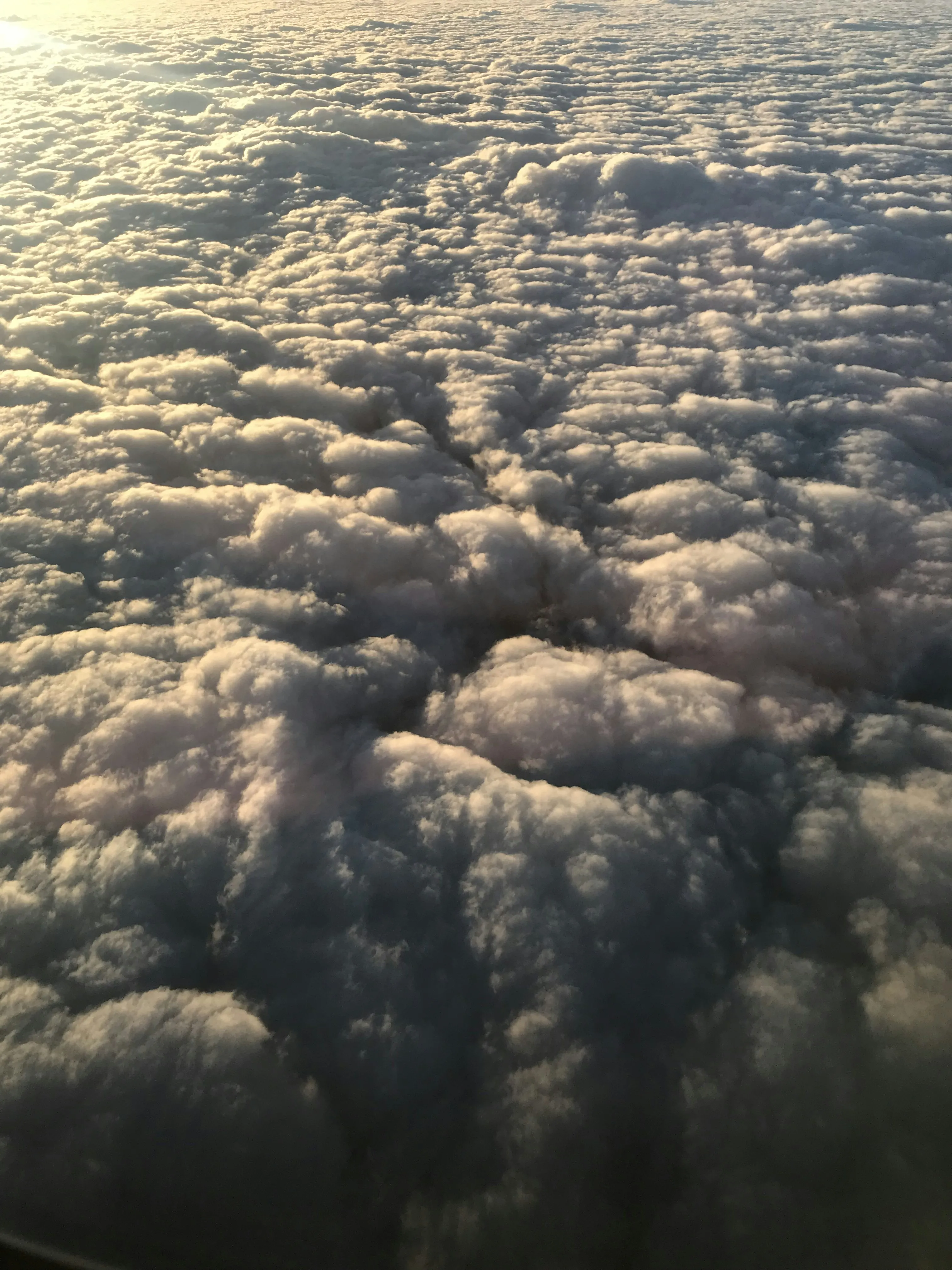 Thick Dense Clouds Seen From Above with Golden Light