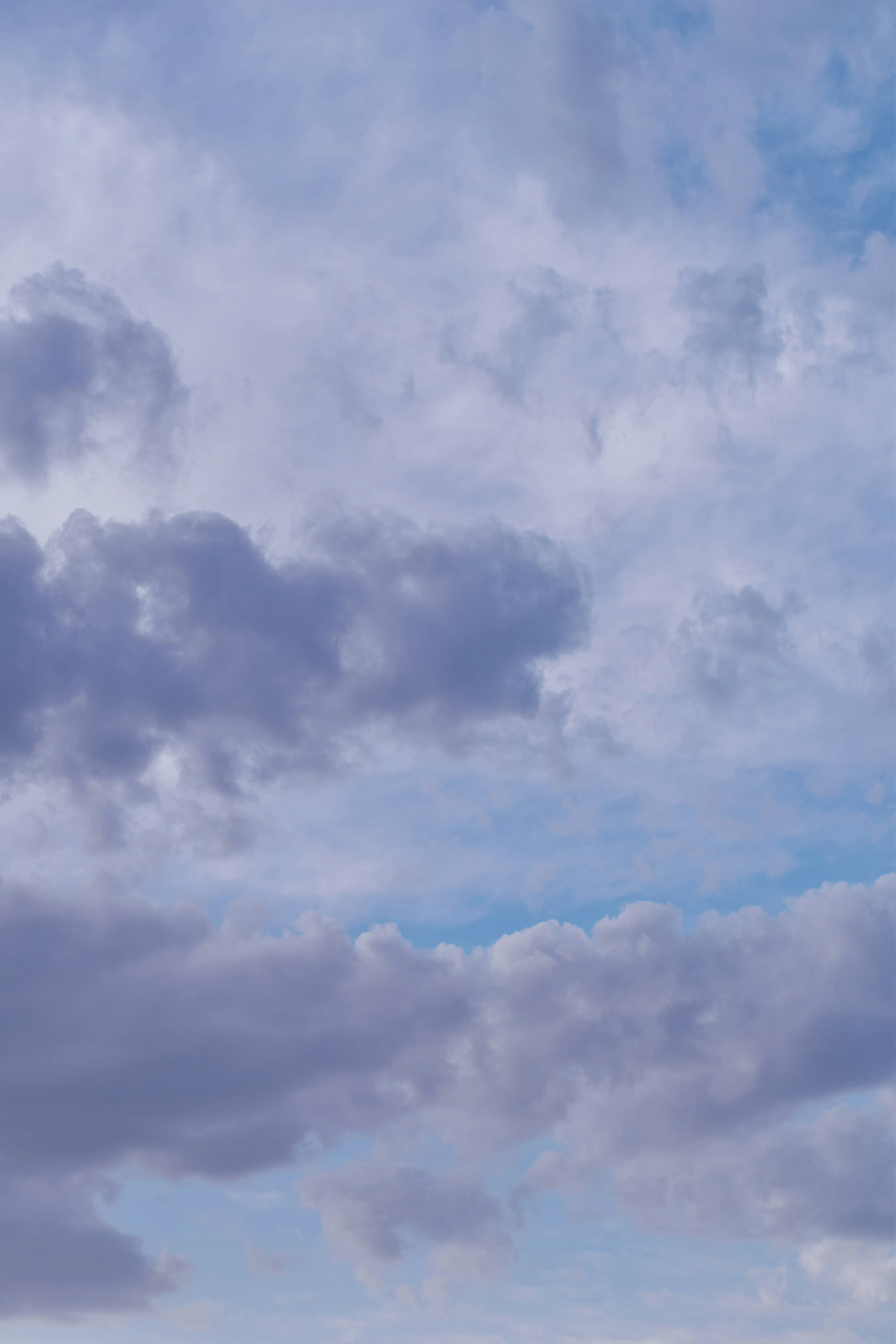 Thick Purple Clouds Rolling in Across Dusk Sky Wallpaper