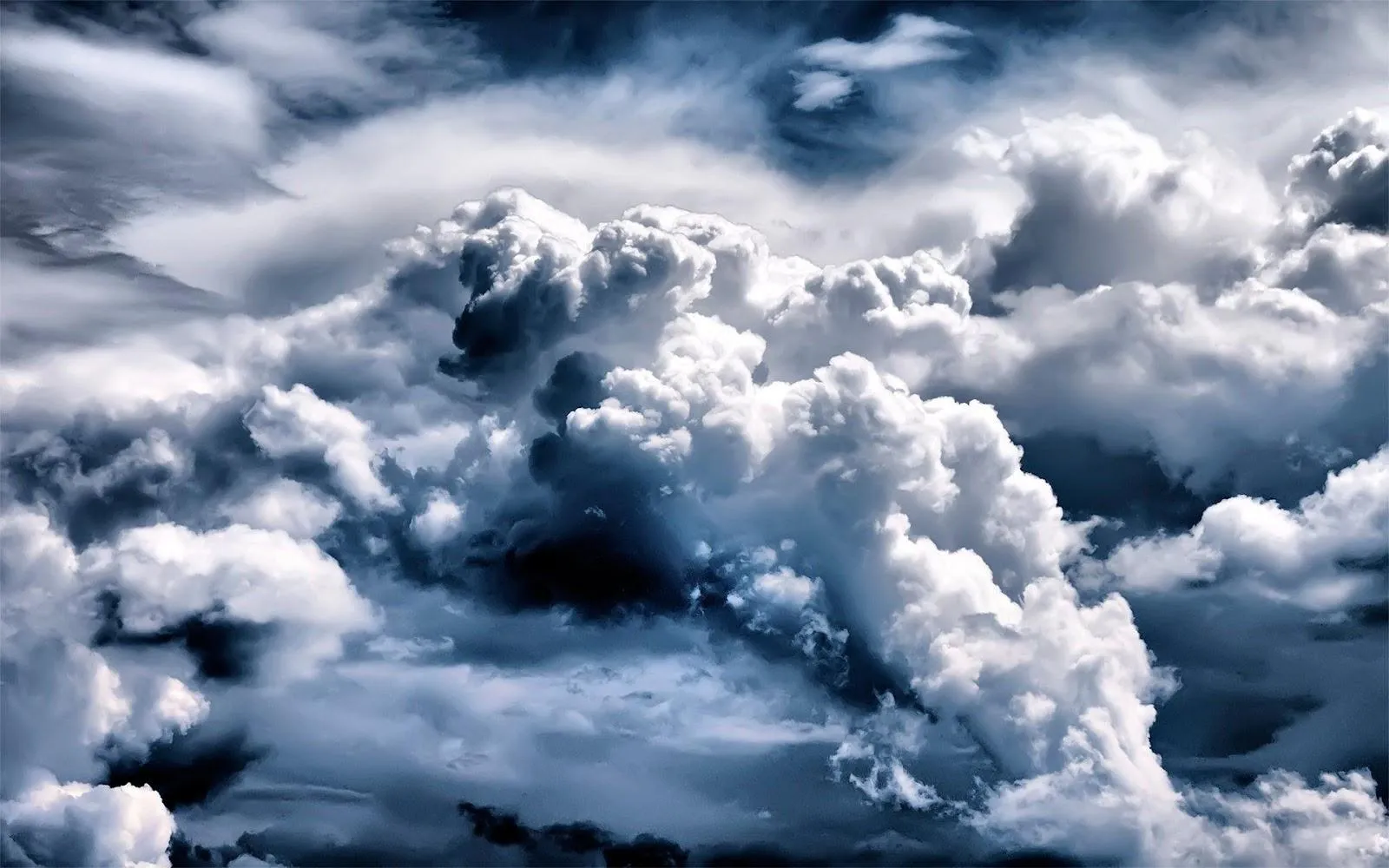 Thick White Clouds in a Dramatic Blue Sky Free 4K Image