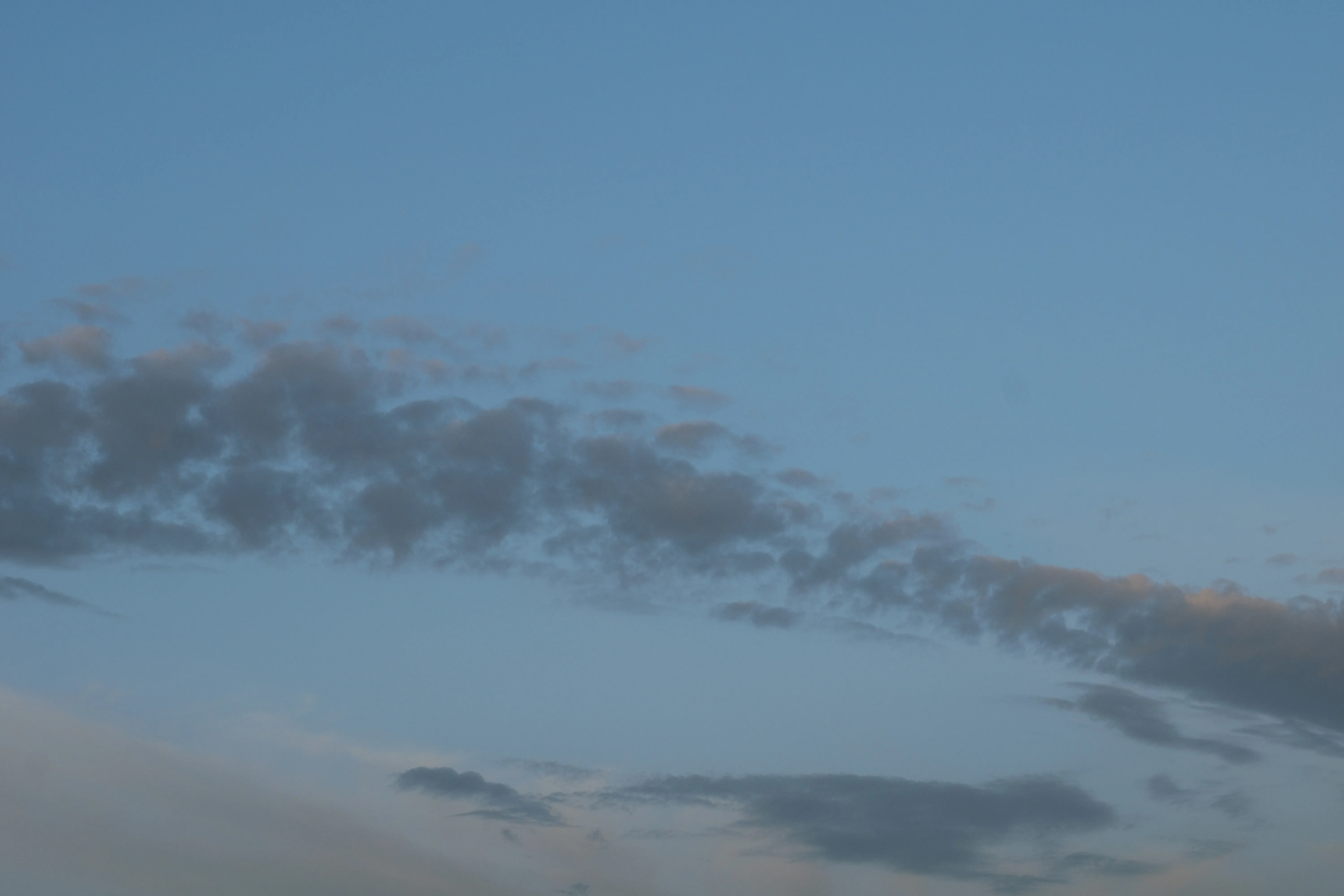 Thin Gray Clouds Floating Over Calm Evening Sky Wallpaper