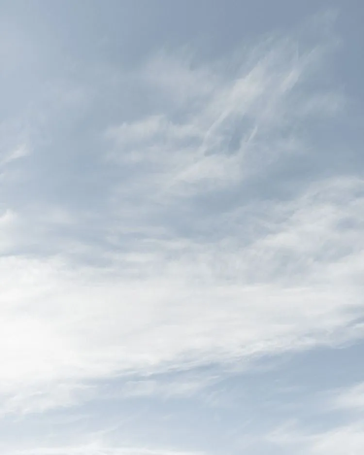 Thin Wispy Clouds in a Pale Blue Sky Above Free HD Wallpaper