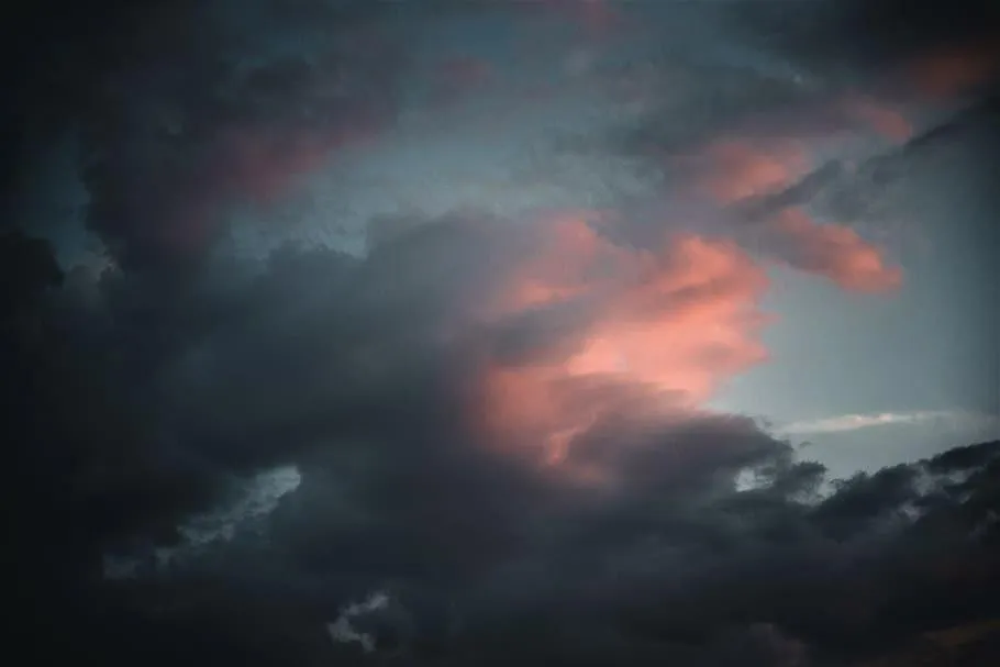 Thunderstorm Clouds with Glowing Red Evening Light Image
