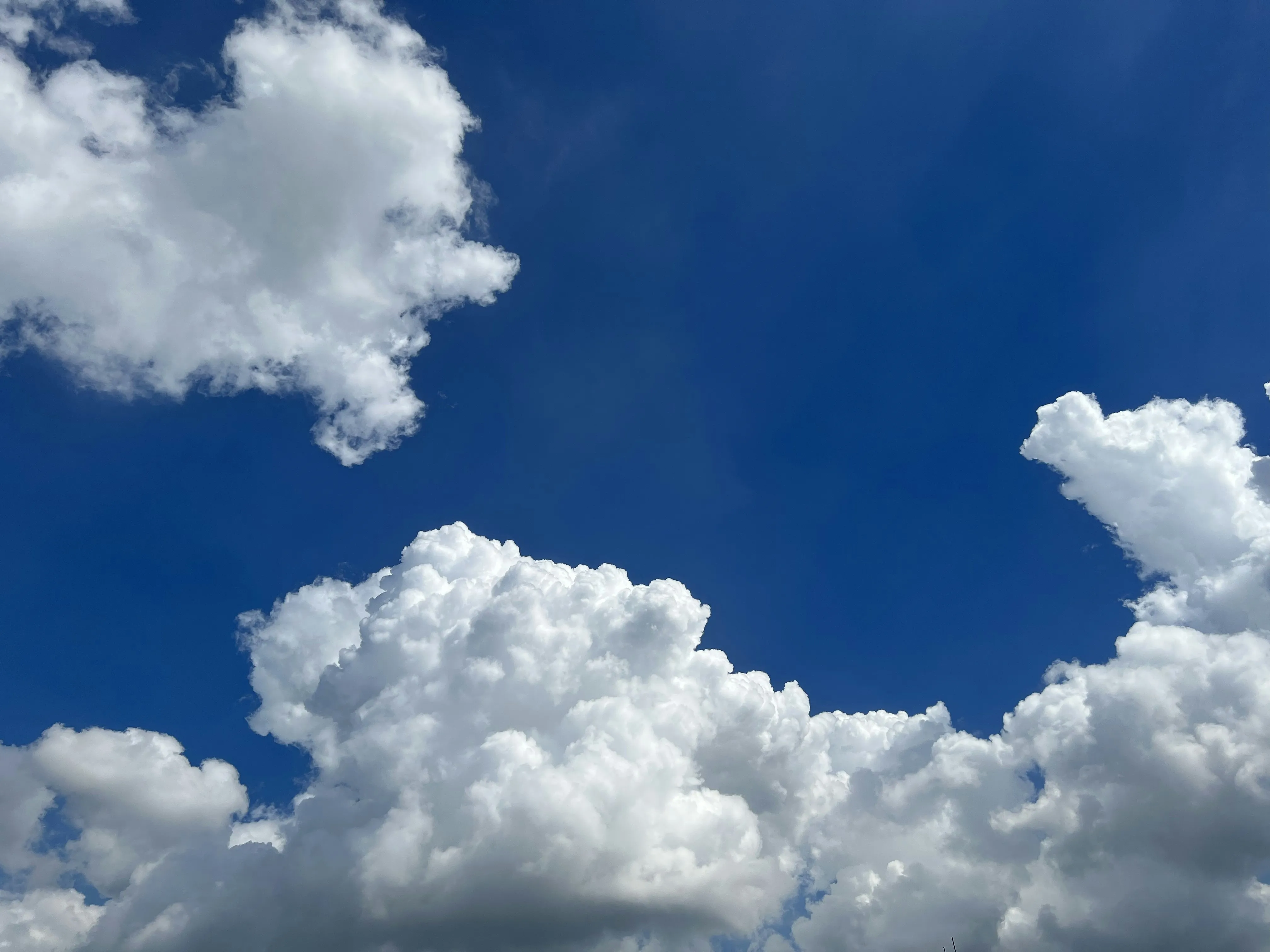 Towering Cloud Mass Over Land Seen From High Altitude