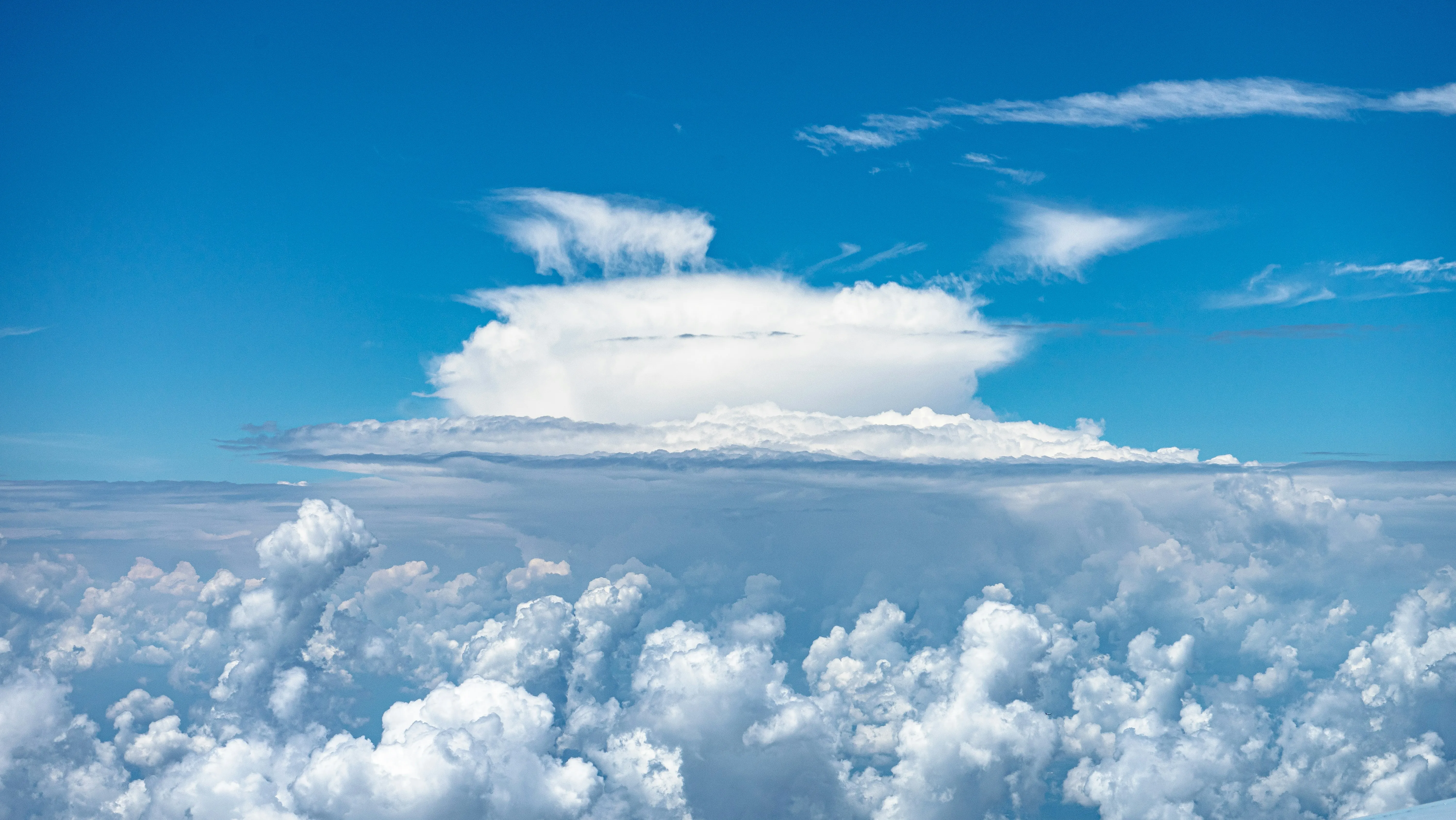 Towering White Cumulonimbus Cloud Over Horizon Wallpaper