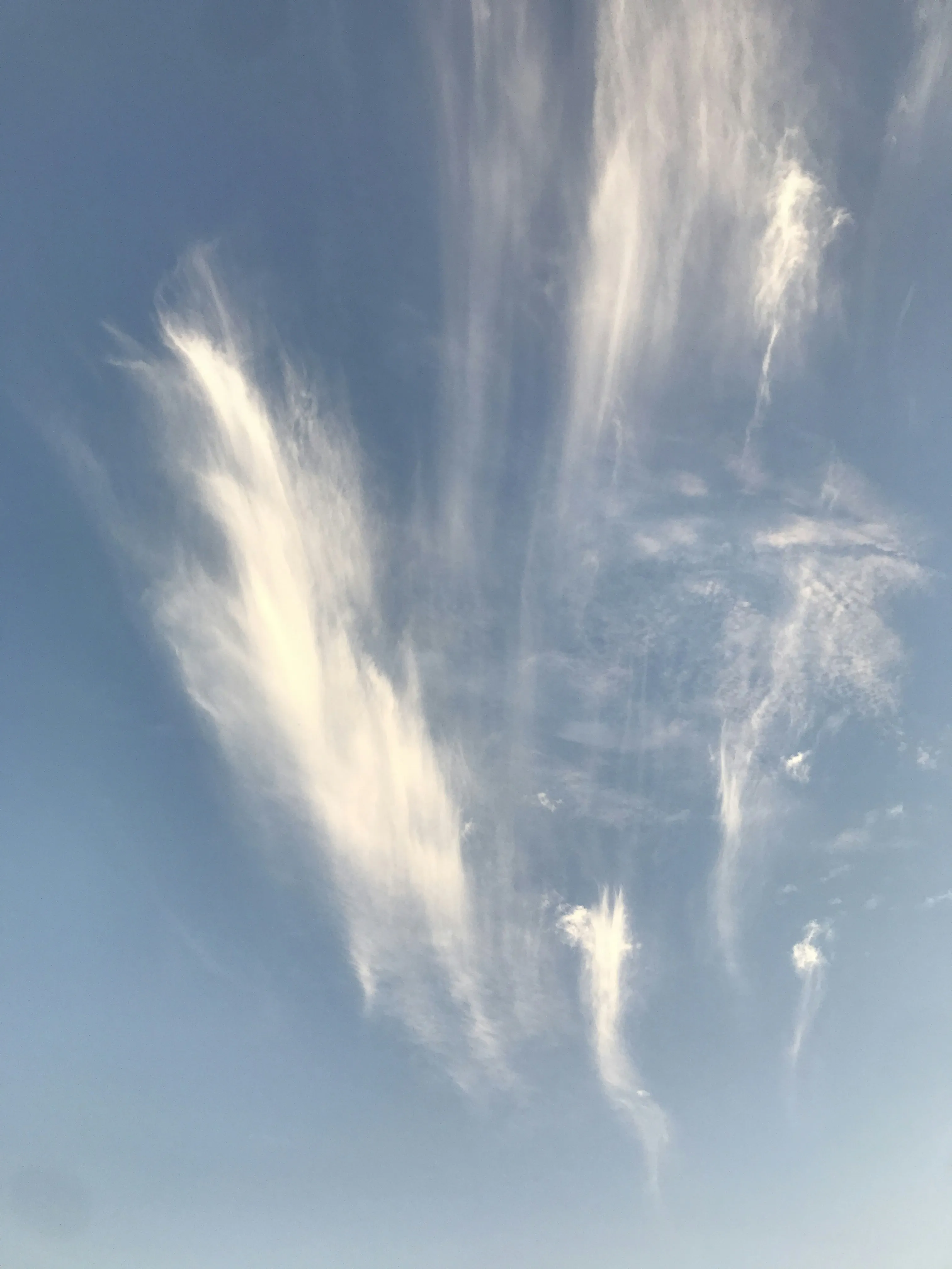 Unique Cloud Formation Against a Deep Blue Sky Image