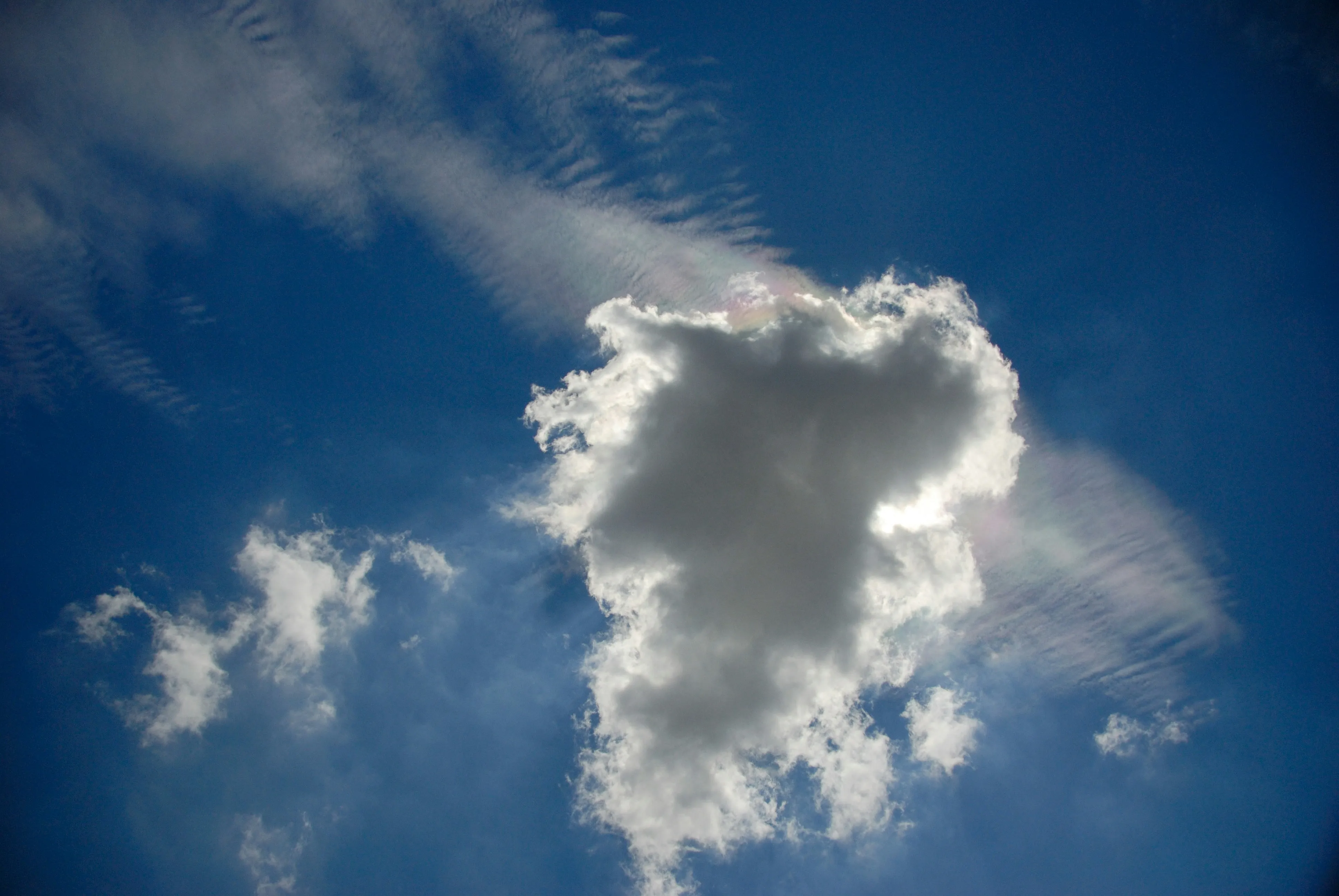 Unique Cloud Formation Against Deep Blue Sky on Sunny Day