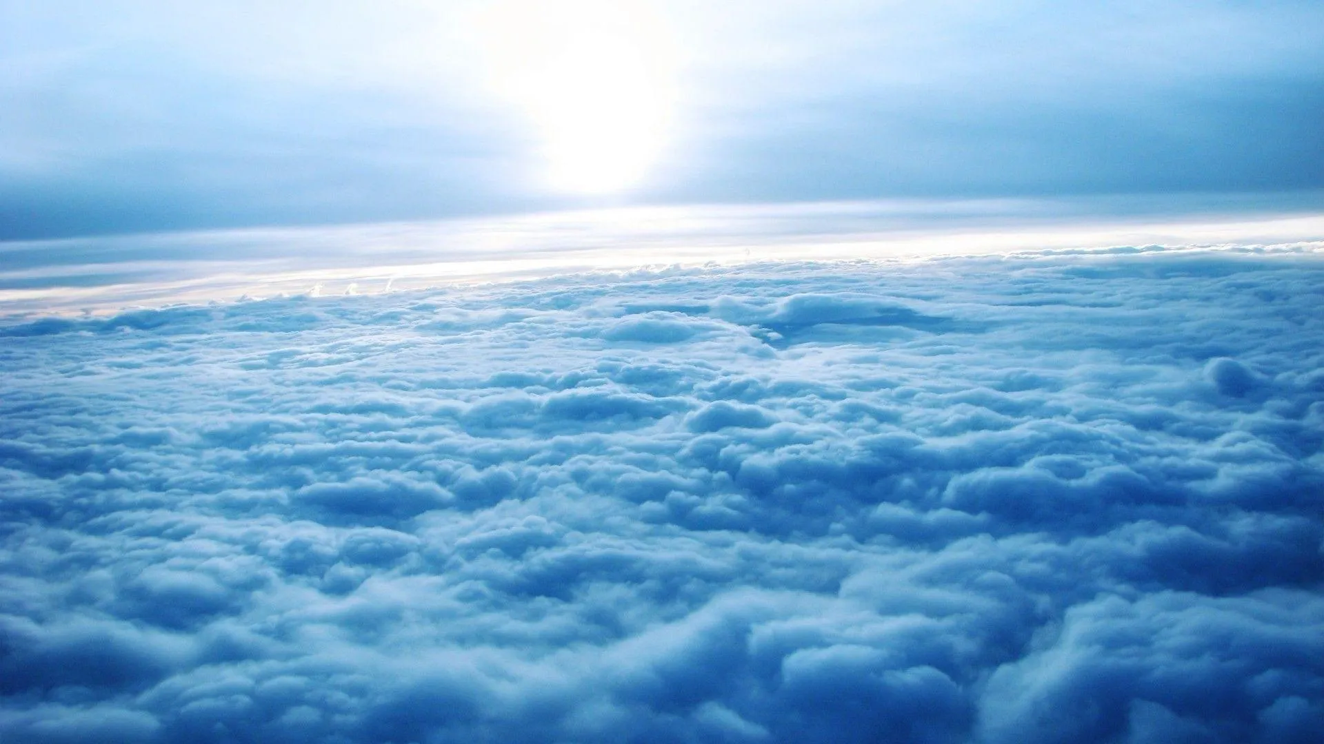 Vast Sea of Clouds Under Soft Morning Light Wallpaper