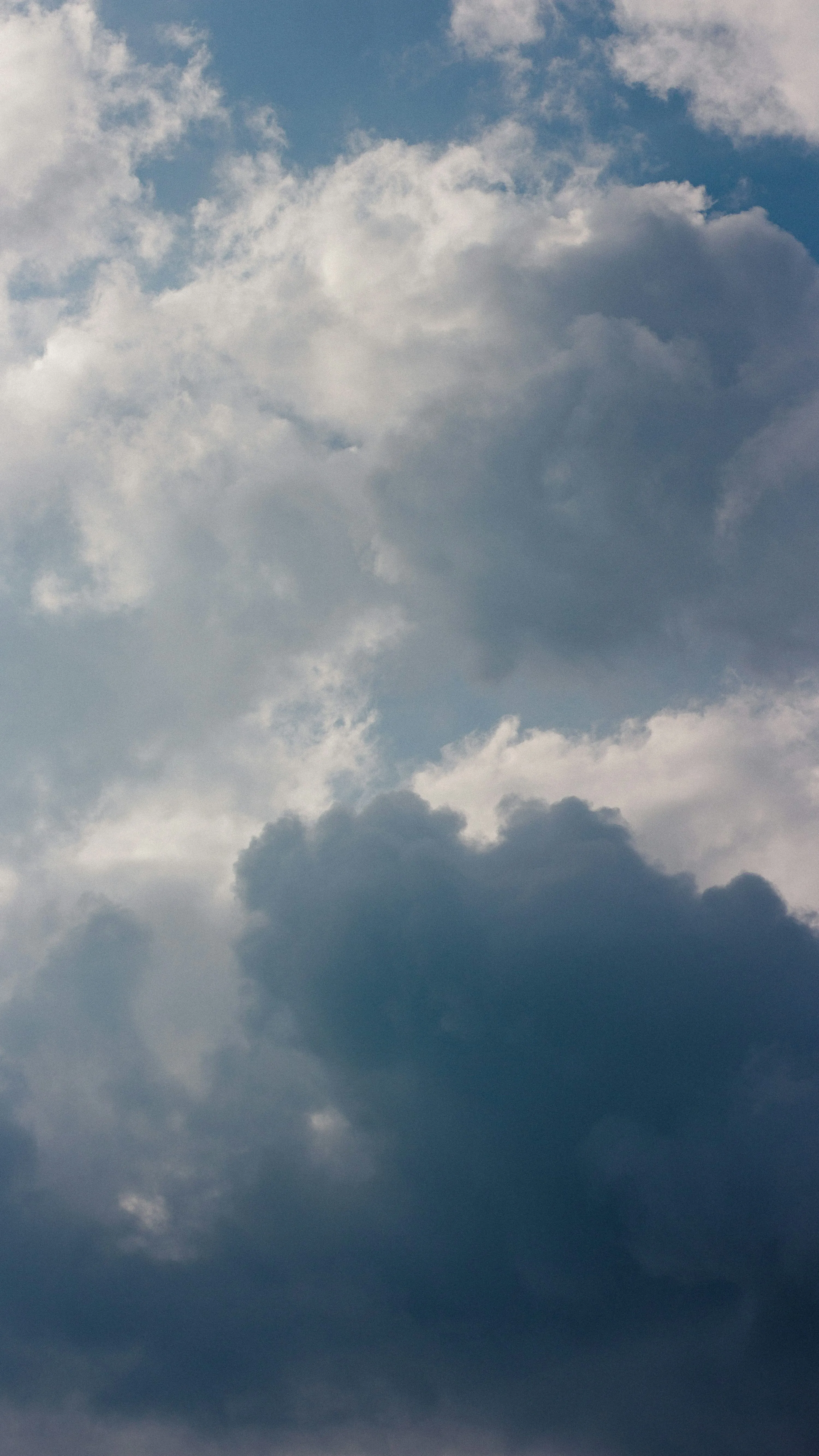 Vertical View of Thick Clouds in Moody Sky HD Wallpaper