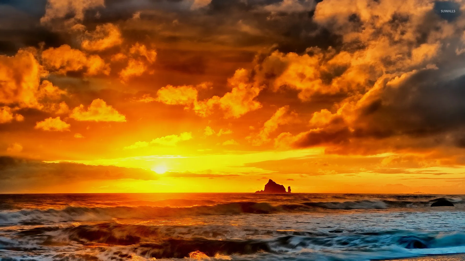 Vibrant Ocean Sunset with Fiery Sky and Clouds Image