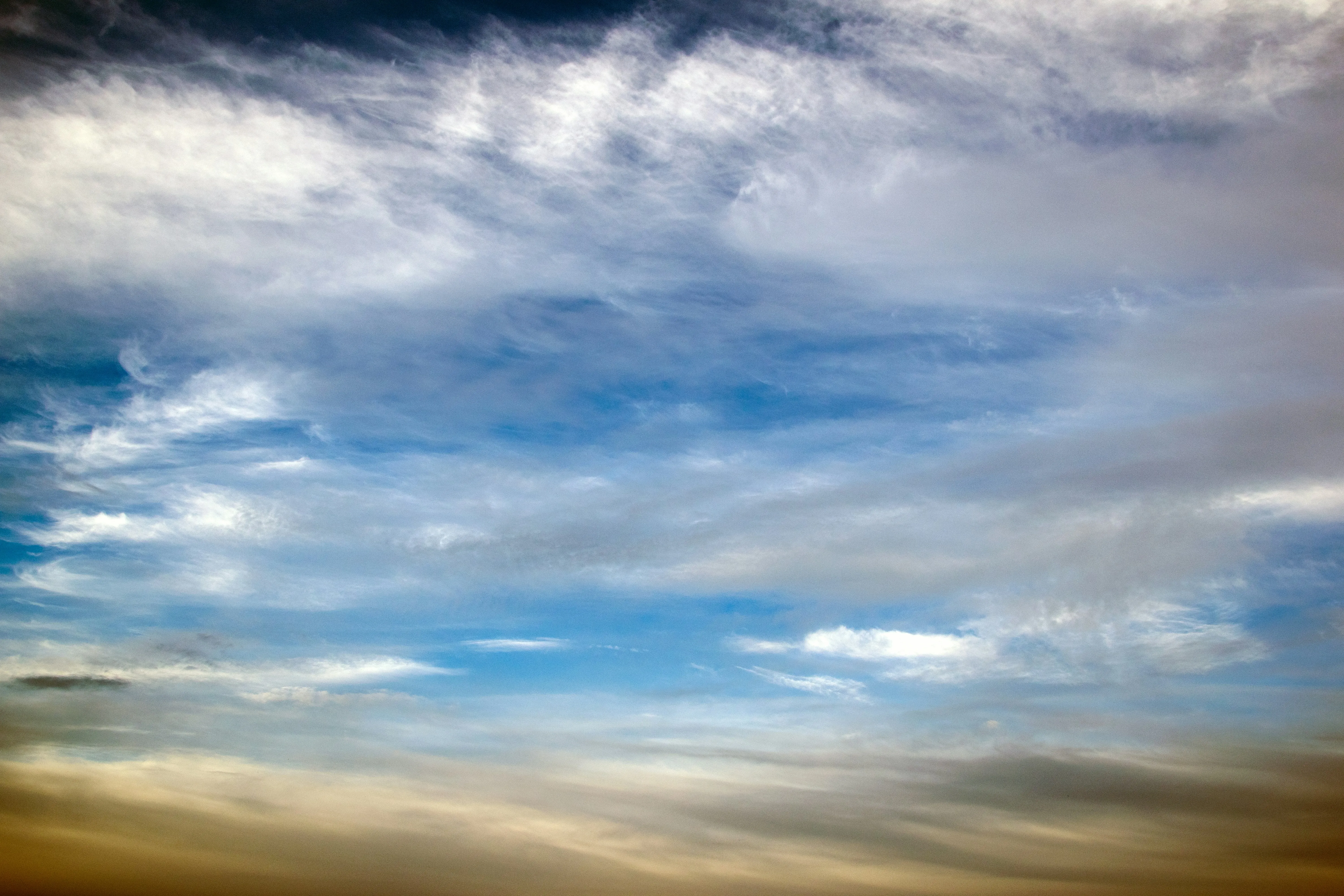 Vibrant Sky with Layered Clouds at Golden Hour Image