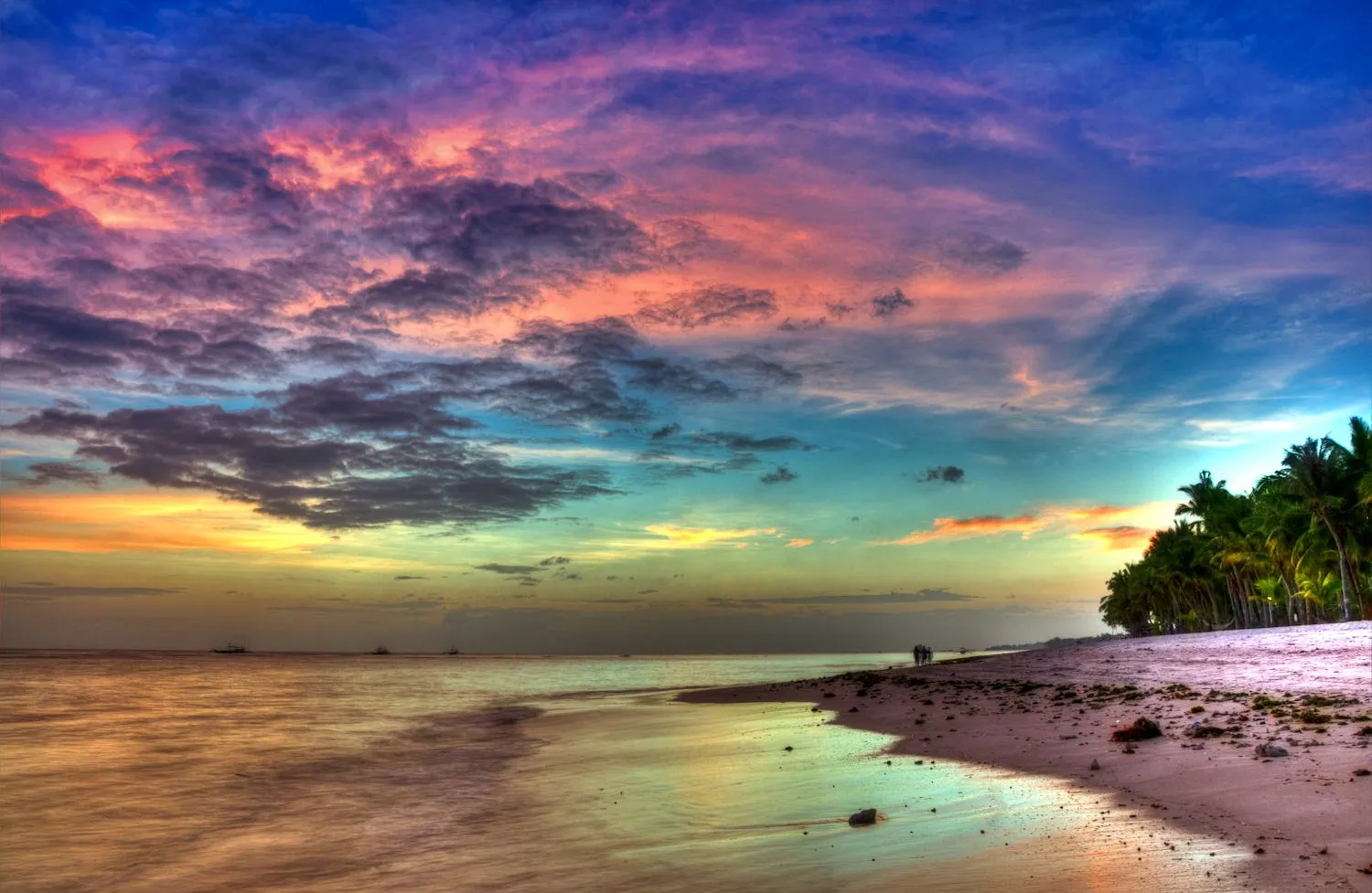 Vibrant Sunset Over Calm Beach with Colorful Clouds Image