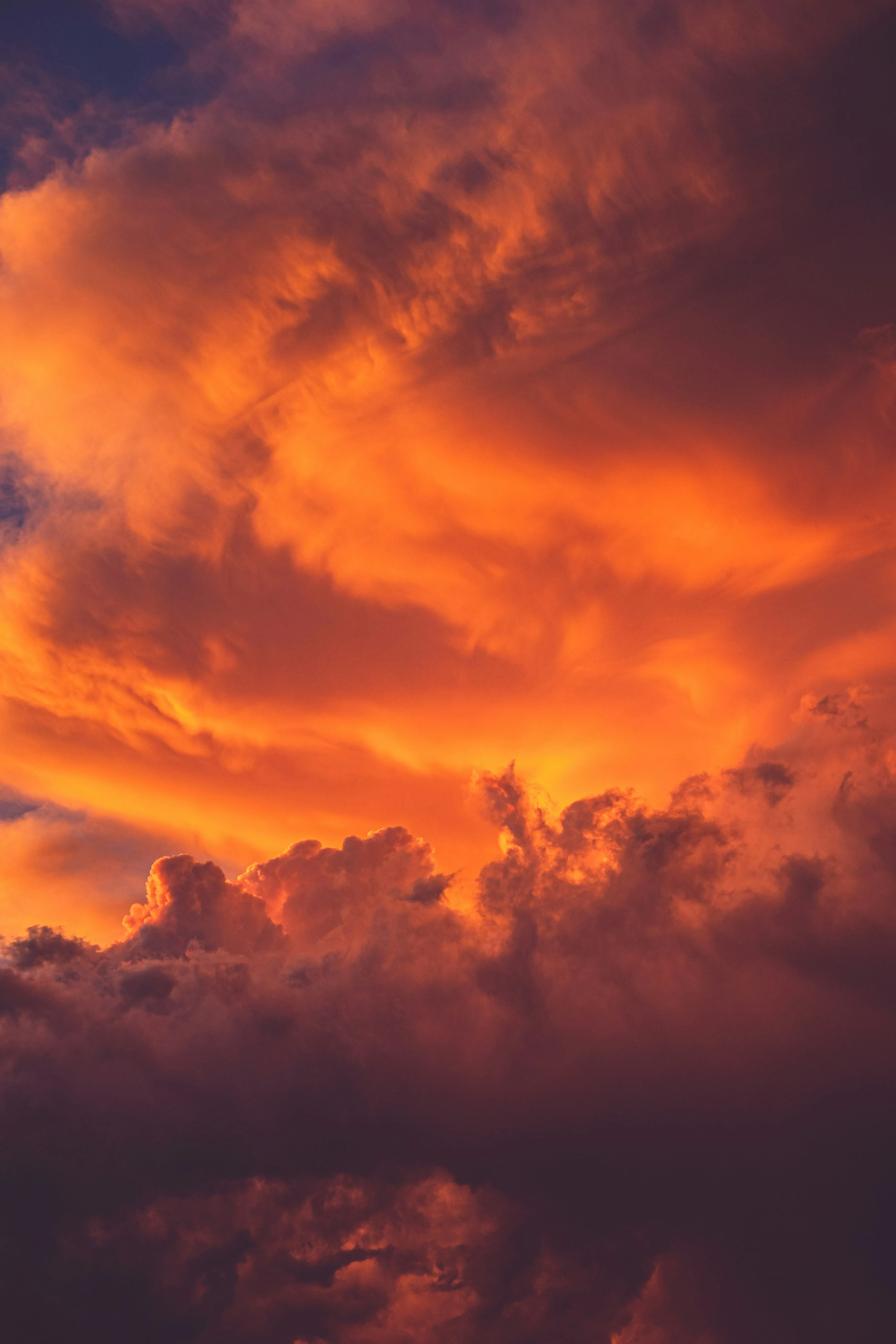 Vibrant Sunset Sky Filled with Glowing Orange Clouds