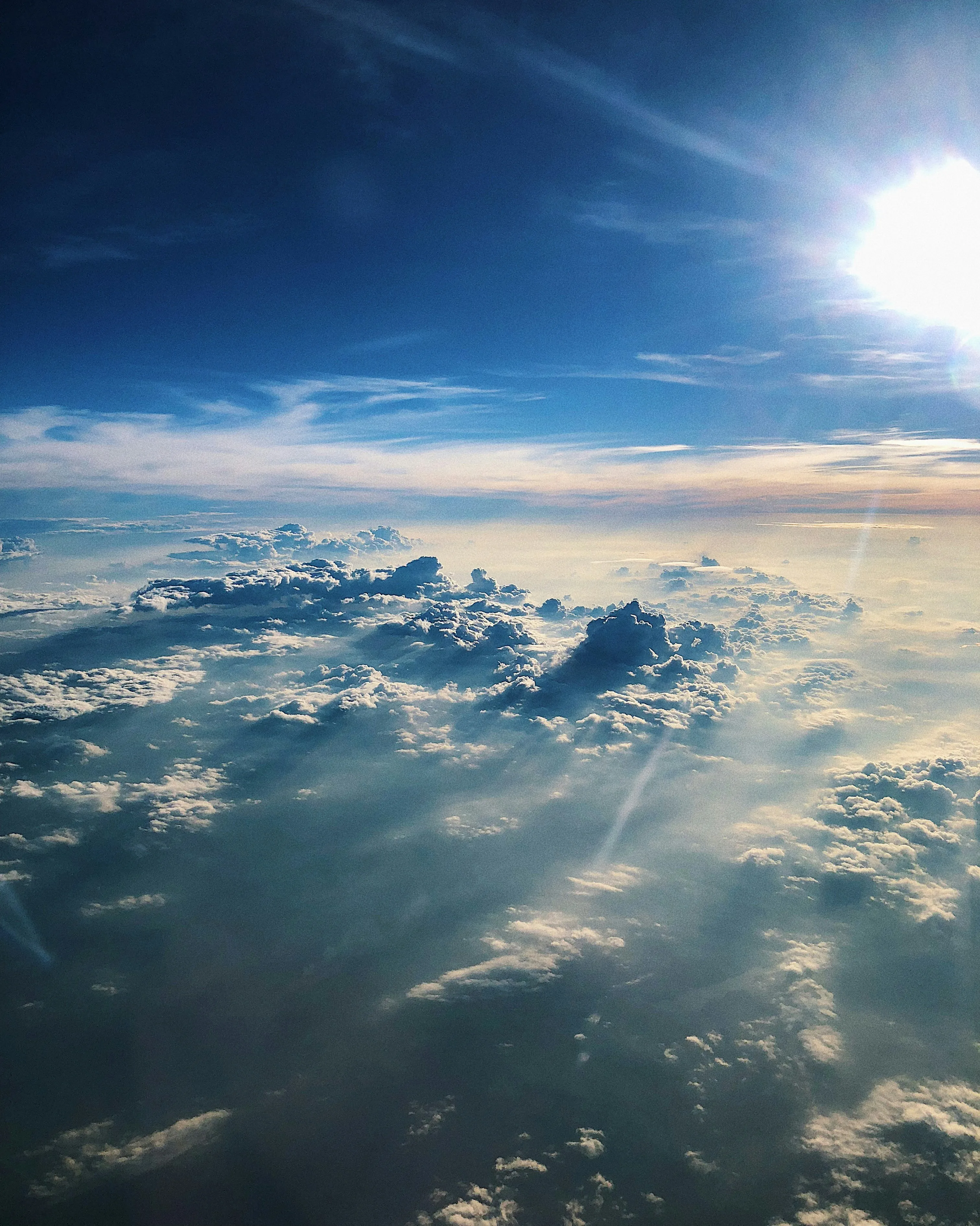 View From Airplane Window Showing Clouds and Blue Sky HD