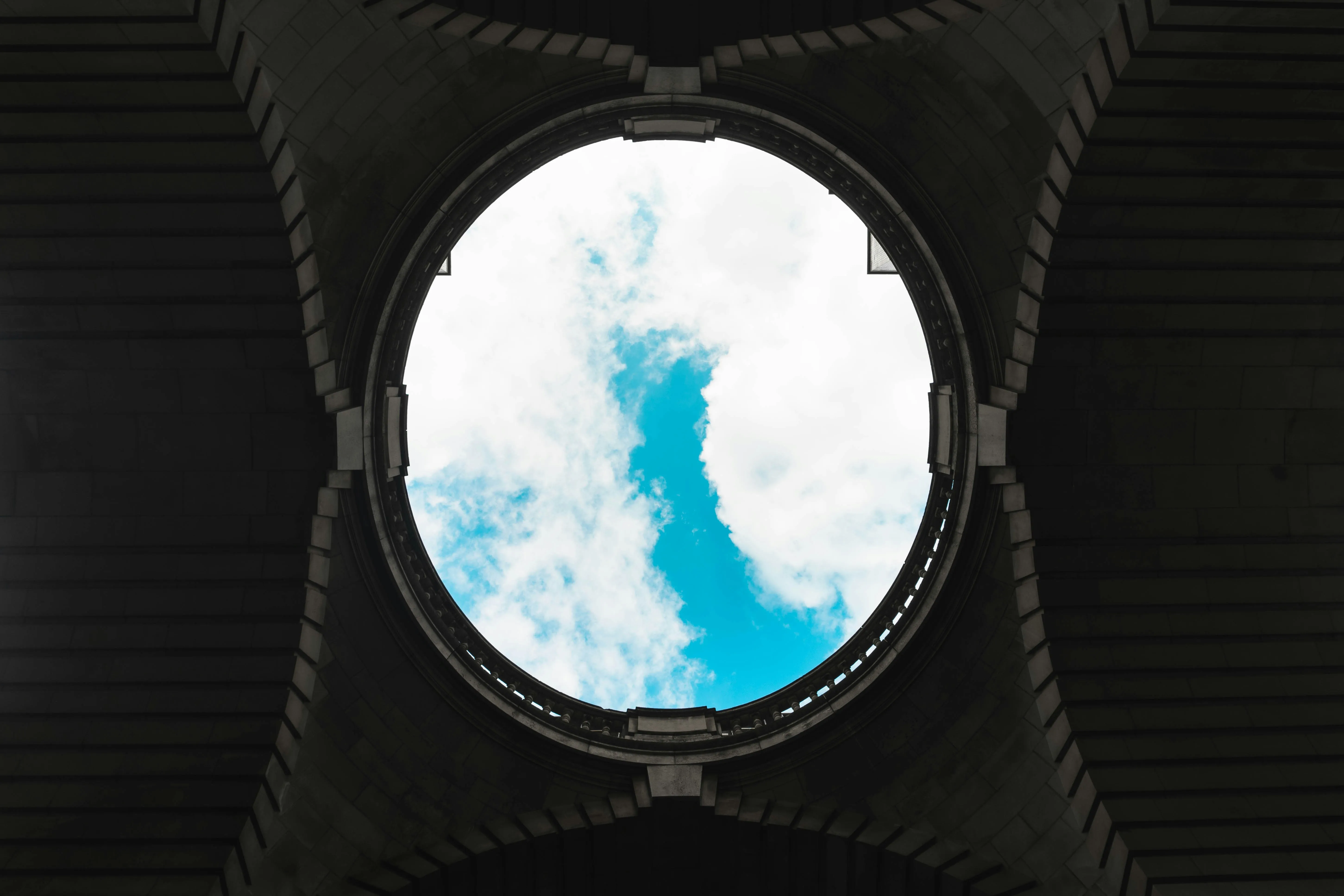 View of the Blue Sky Through a Circular Tunnel Opening