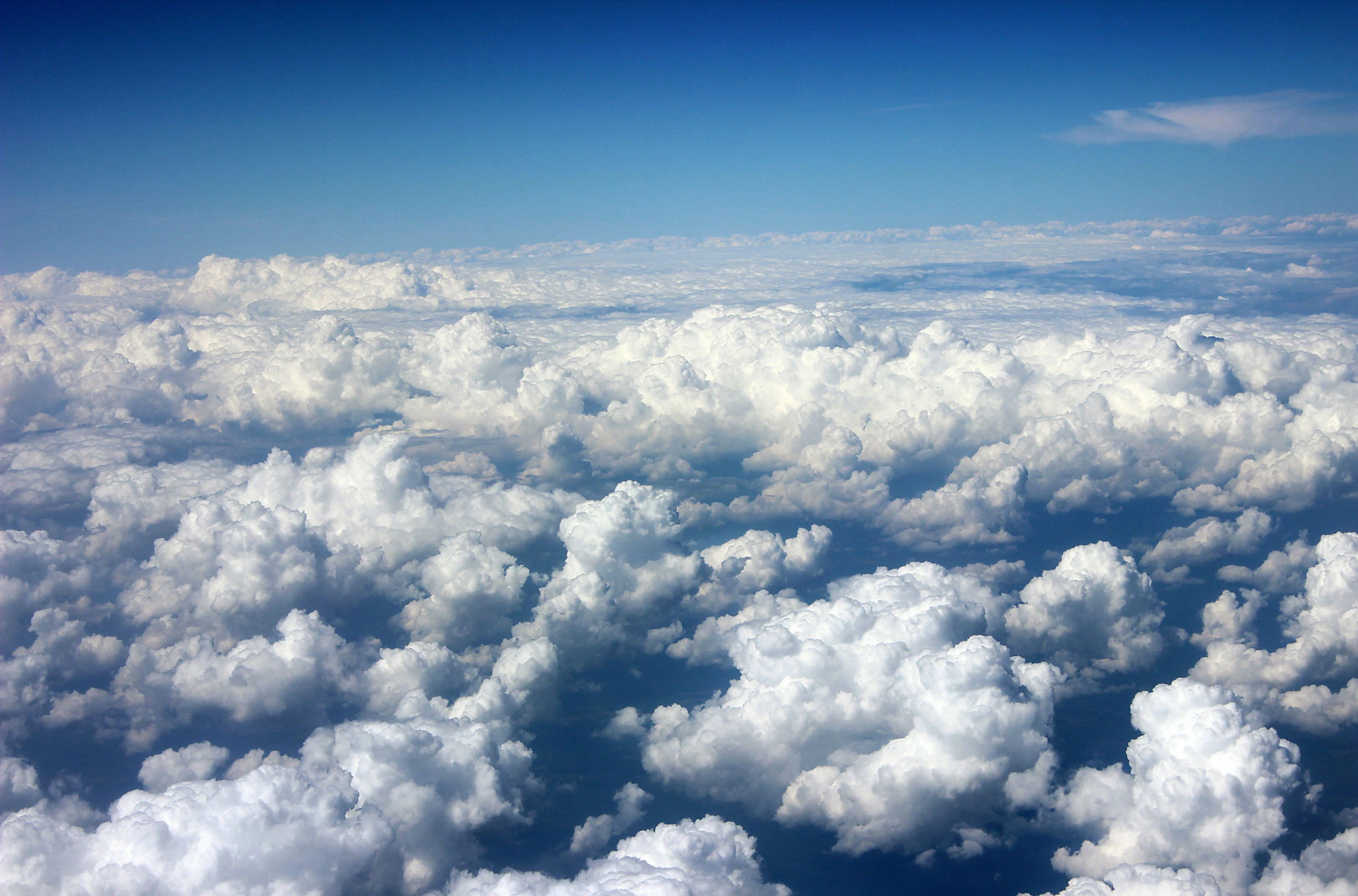 View of Thick Clouds Seen From an Airplane Window Image