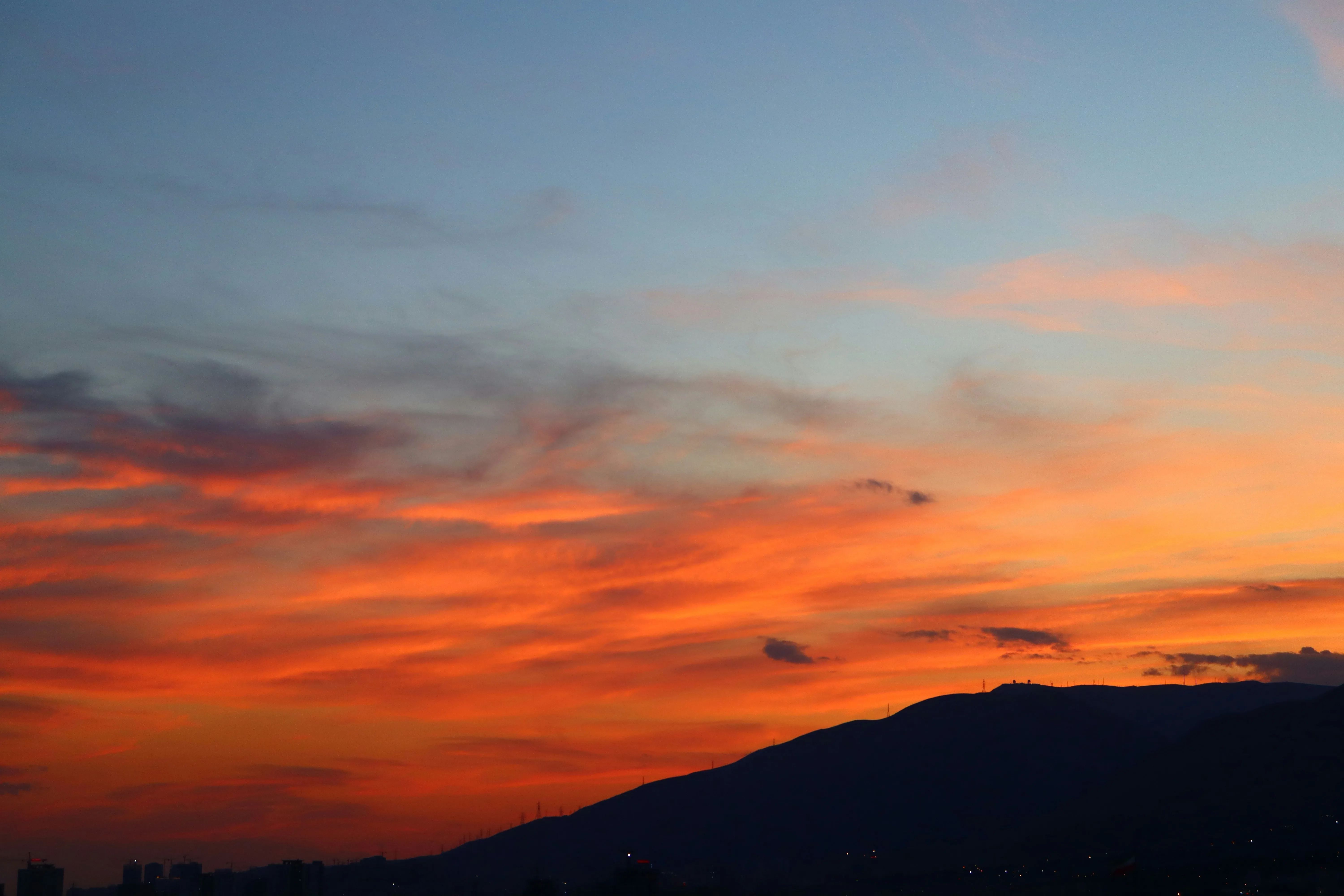 Vivid Orange and Red Sunset Clouds Over the Horizon Image