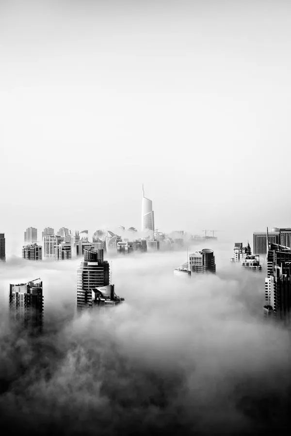 Wallpaper of City Skyline Covered in Thick White Cloud Layer